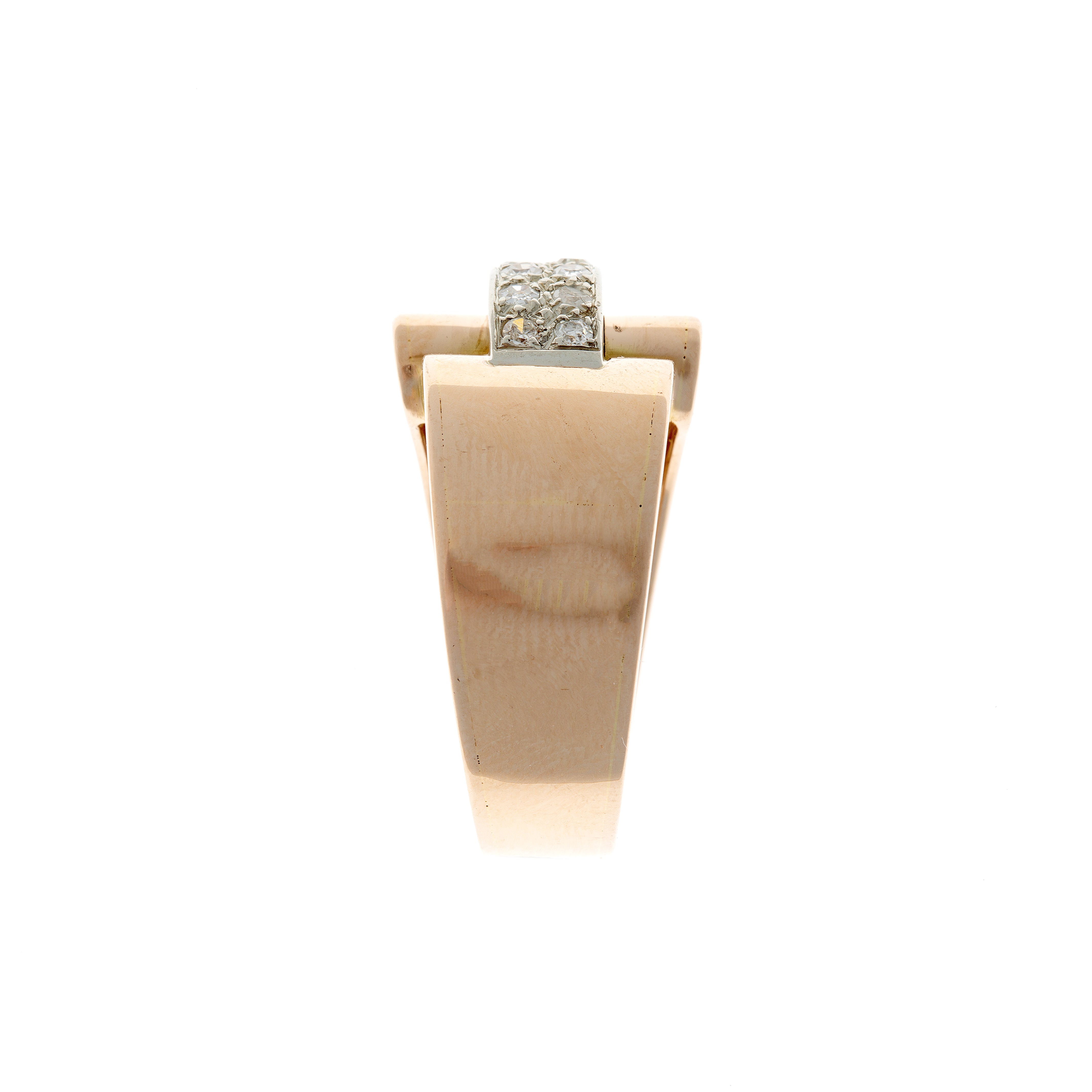 Side view of sculptural Retro gold ring with rubies flanking vertically set round diamonds.