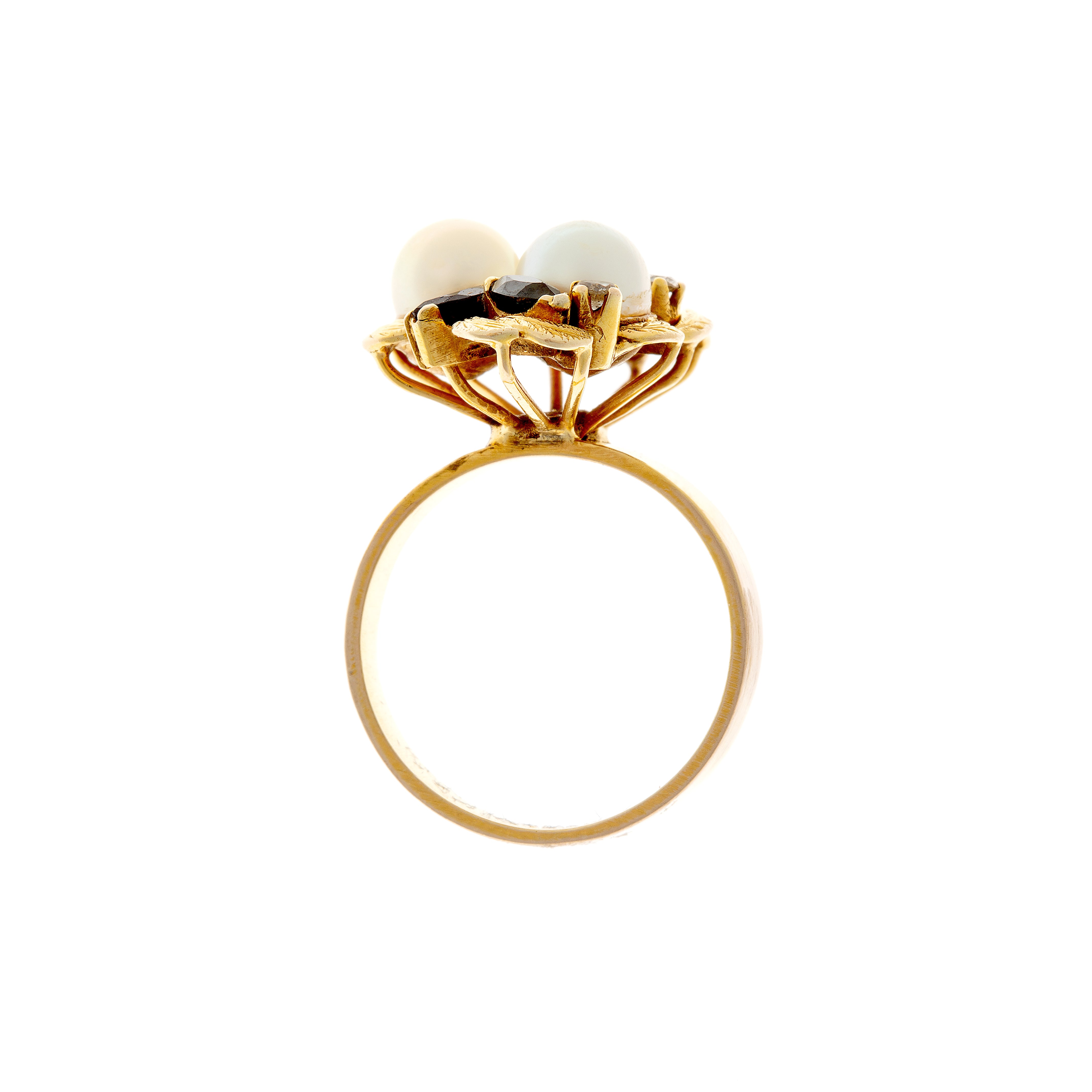 Profile view of Retro cocktail ring with pearls, sapphires, and diamonds set in sculptural gold.