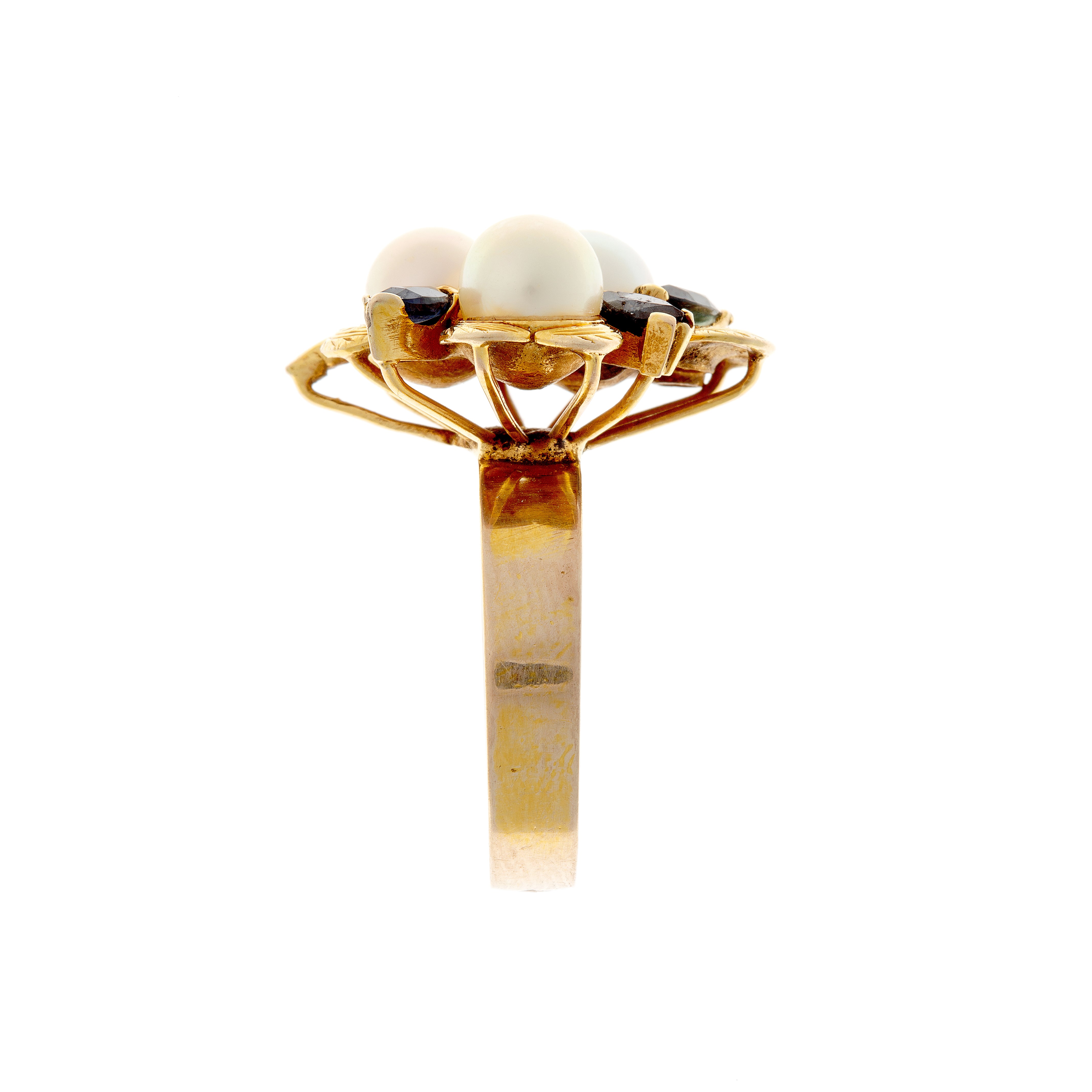 Side view of 1950s gold ring showing split shank and domed gemstone arrangement.