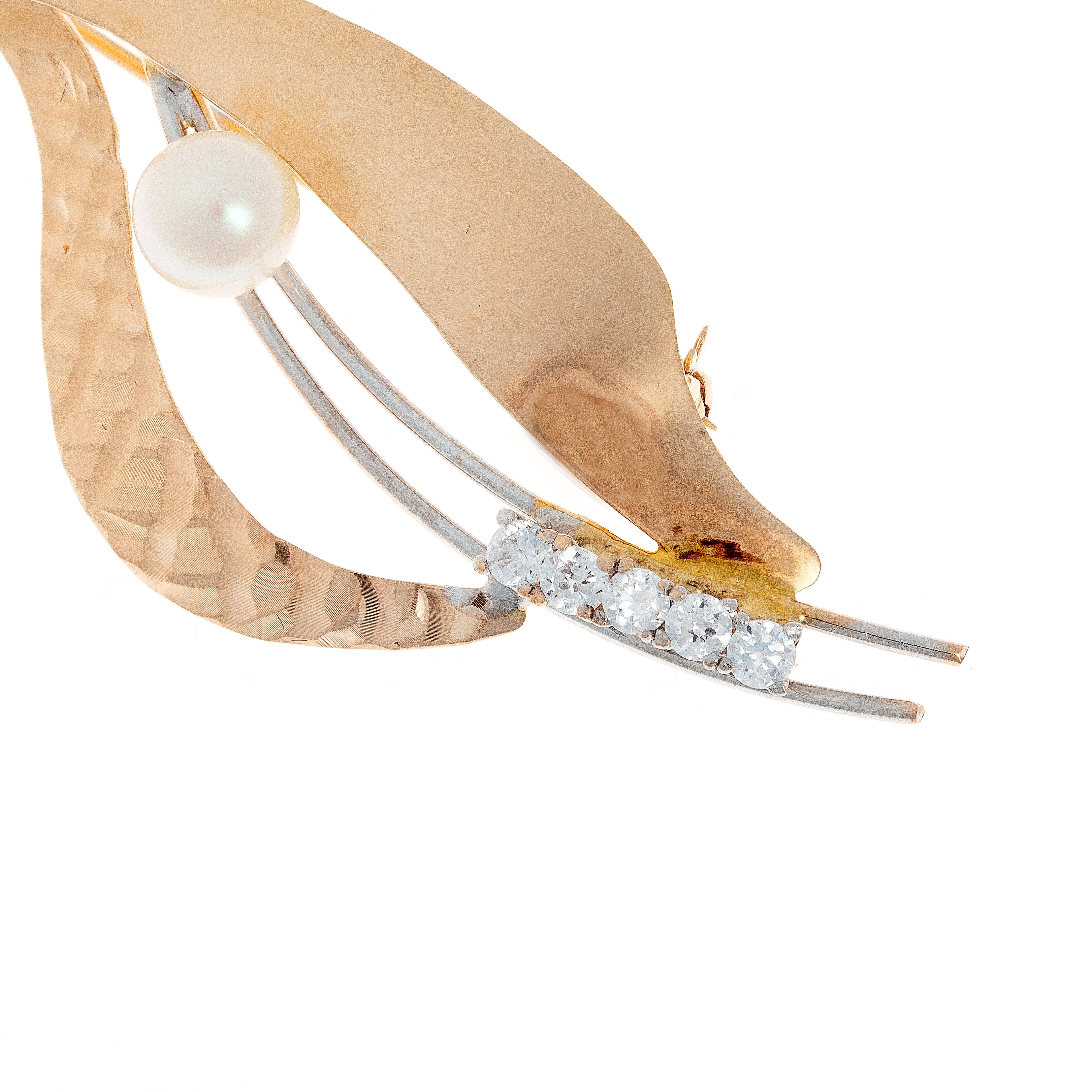 Close-up of 1970s French gold brooch, highlighting pearl centerpiece and cubic zirconia set along white gold wires.