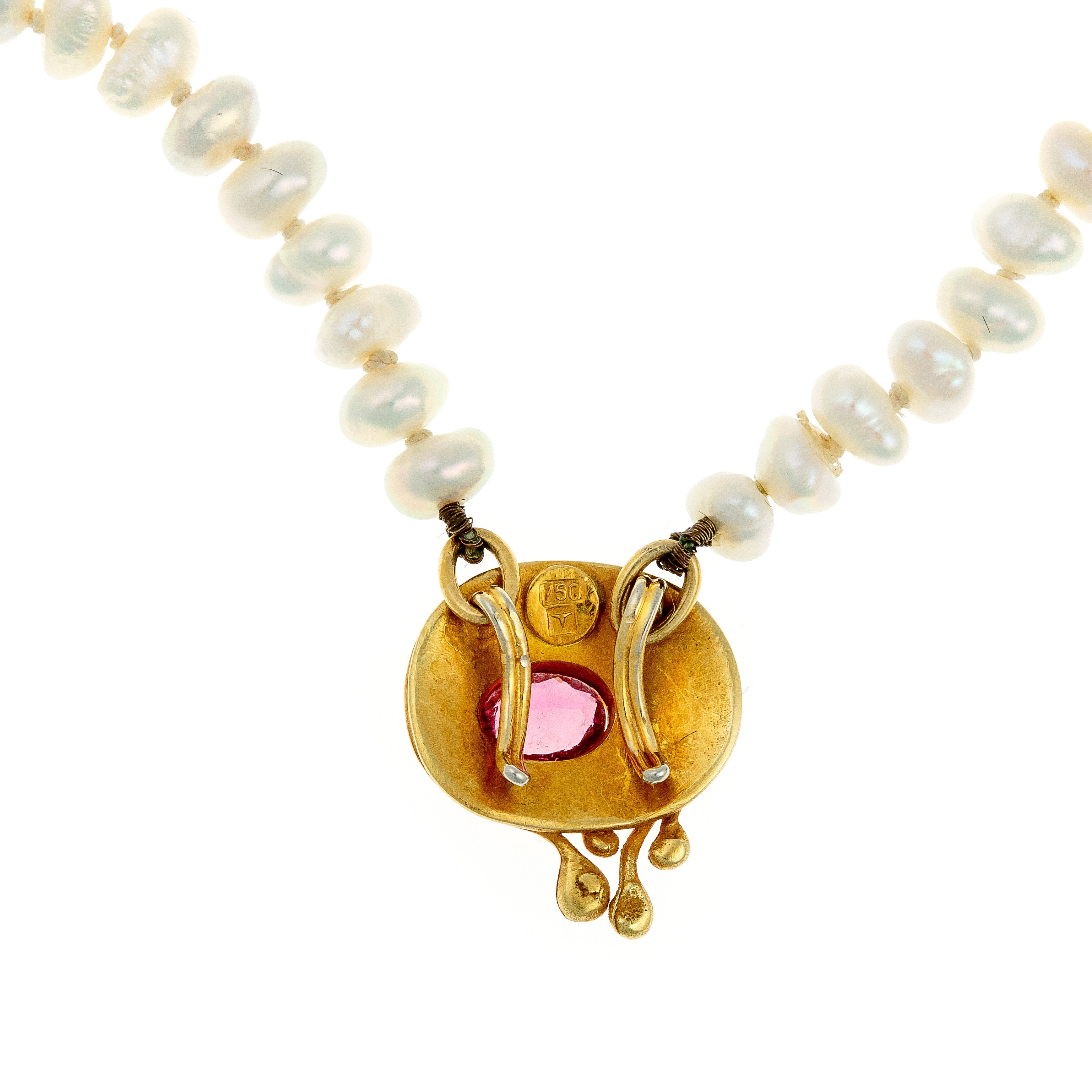 Back view of the gold tourmaline pendant, revealing the handcrafted details and artisanal construction.