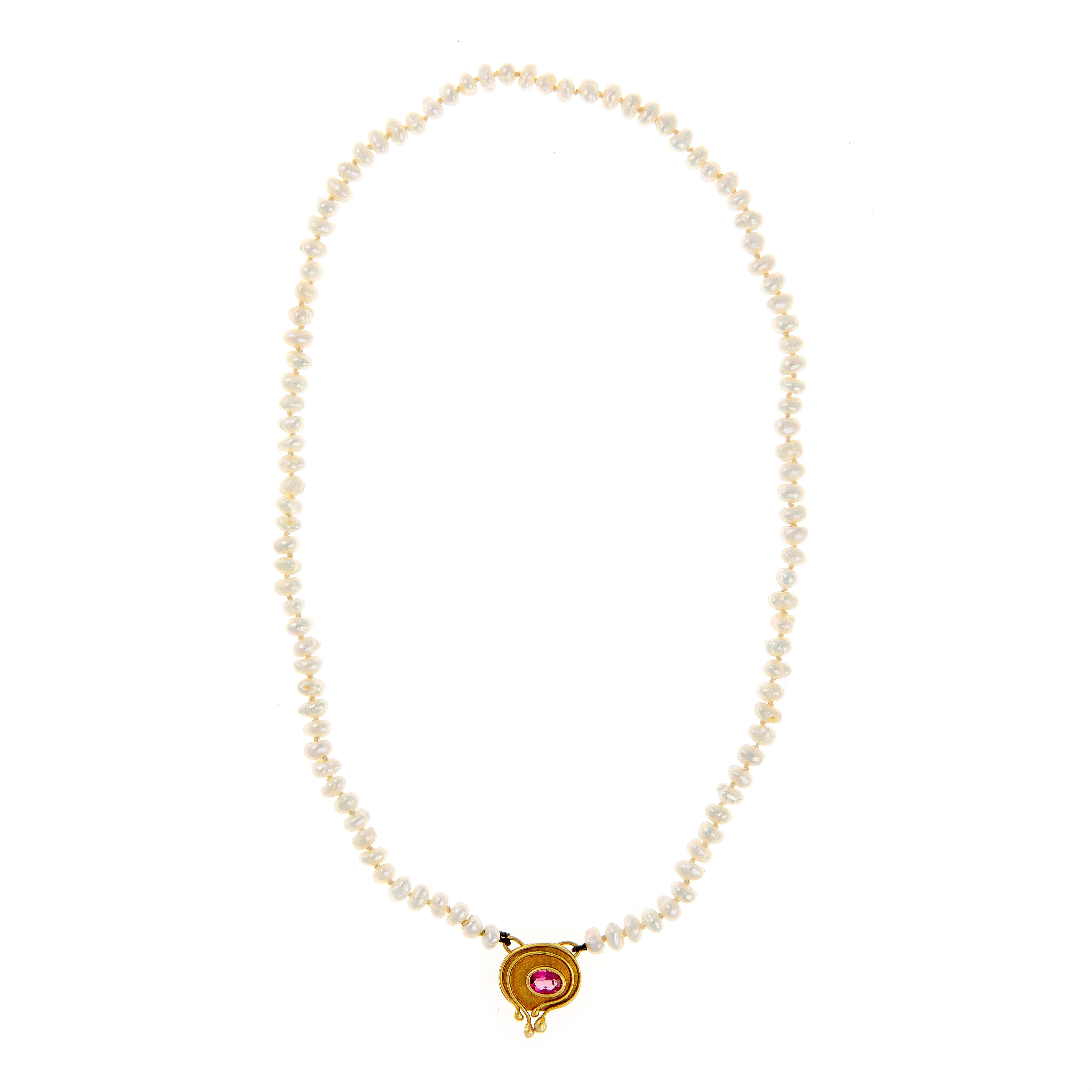 Front view of the 1970s gold and pearl necklace, showcasing the organic sculptural pendant with a pink tourmaline center.
