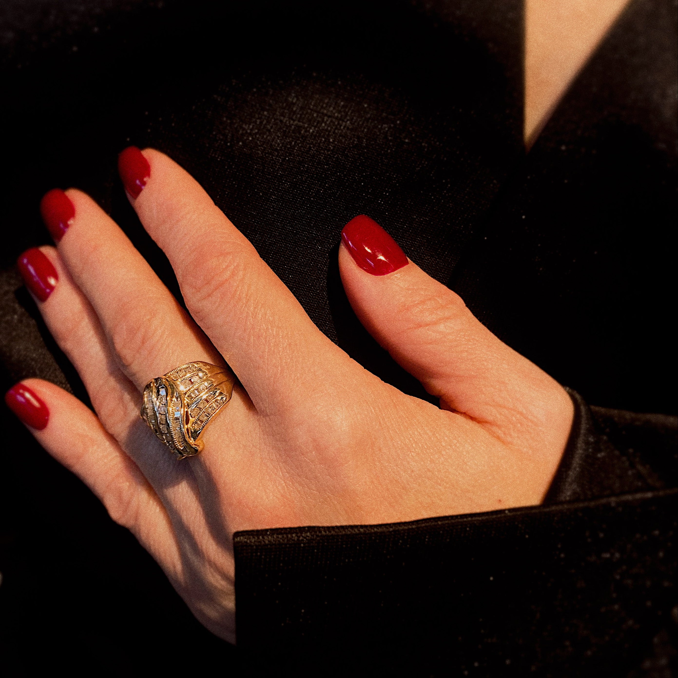 Model wearing the contemporary vintage gold cocktail ring with diamonds.