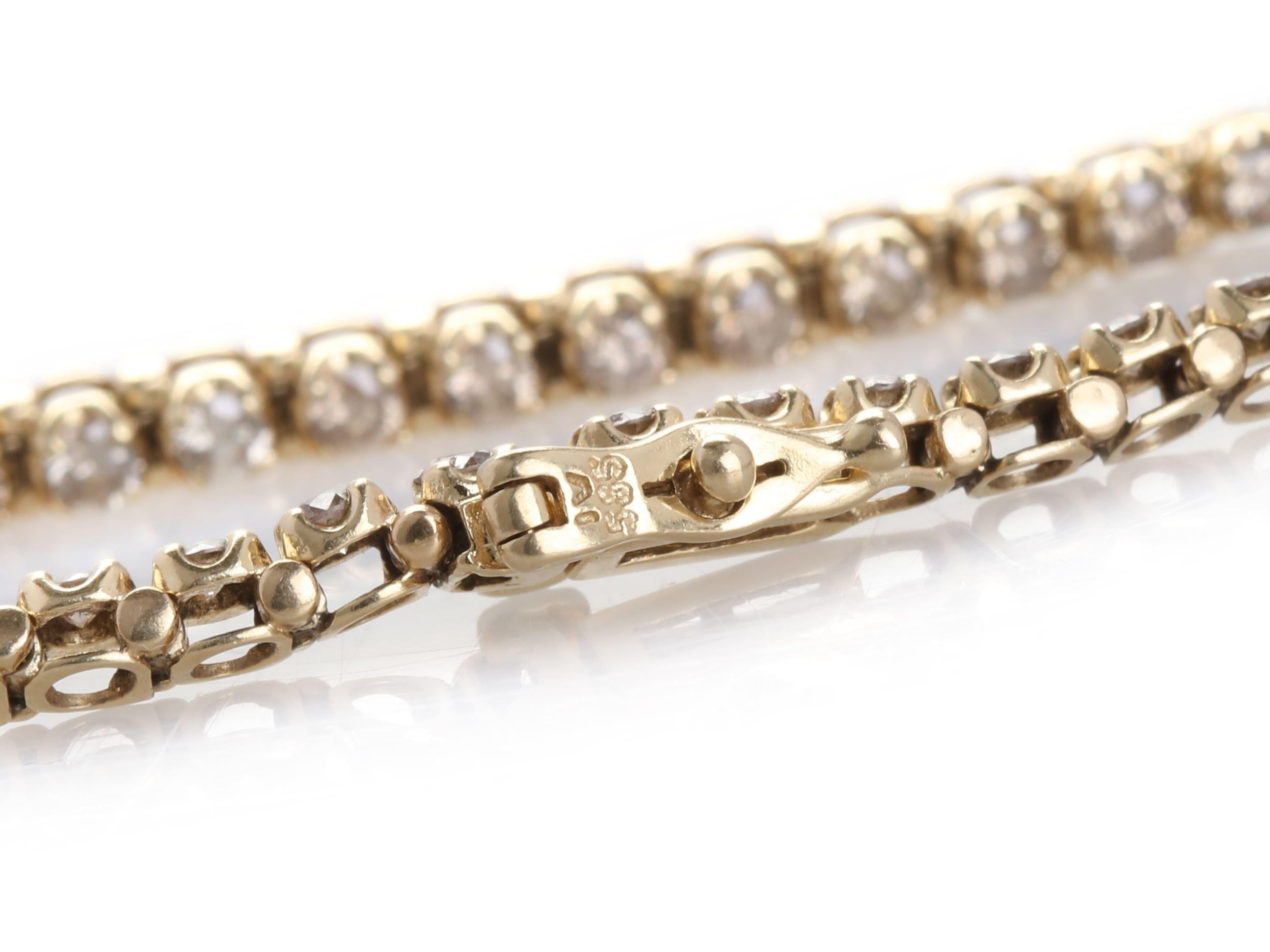 Close-up of the diamond tennis bracelet clasp, showcasing the secure box clasp with a safety latch.