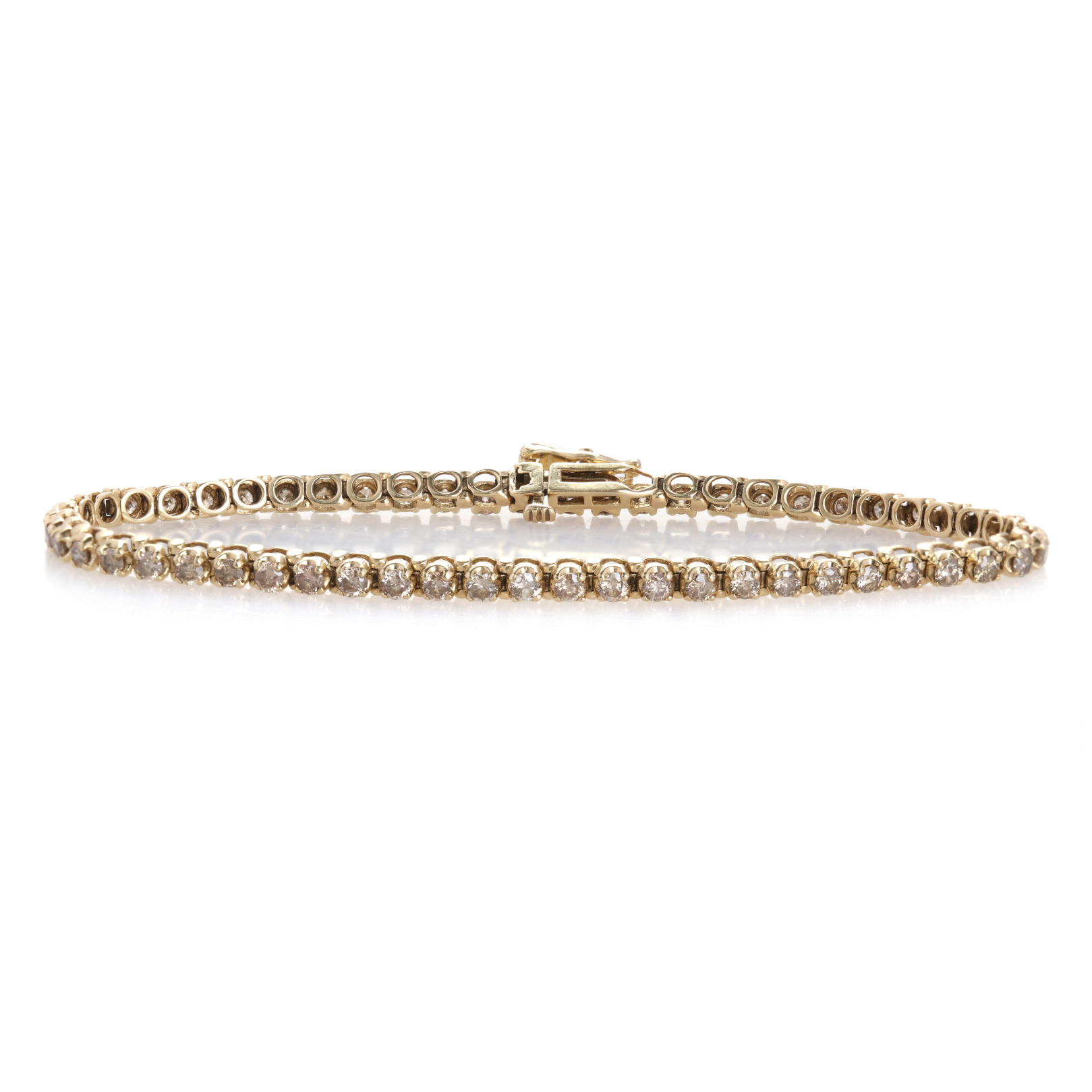 Full view of the 1980s gold tennis bracelet, featuring a seamless row of brilliant-cut diamonds.