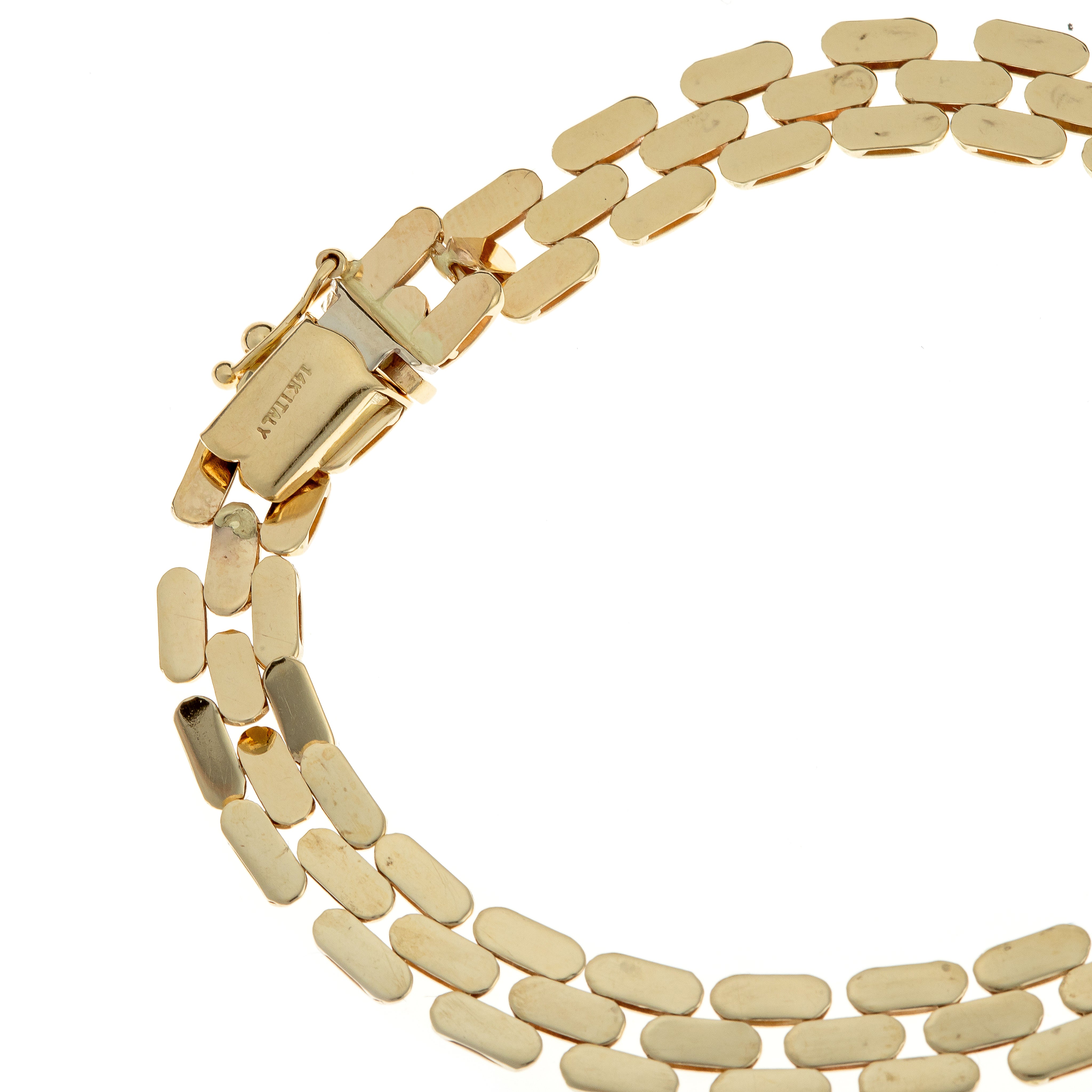 Side perspective of the necklace, capturing the elegant drape of the gold link chain.