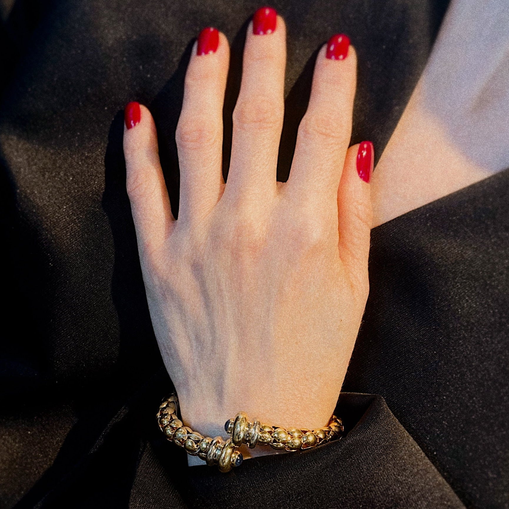 Model wearing the Italian vintage gold cuff bracelet with sapphires.
