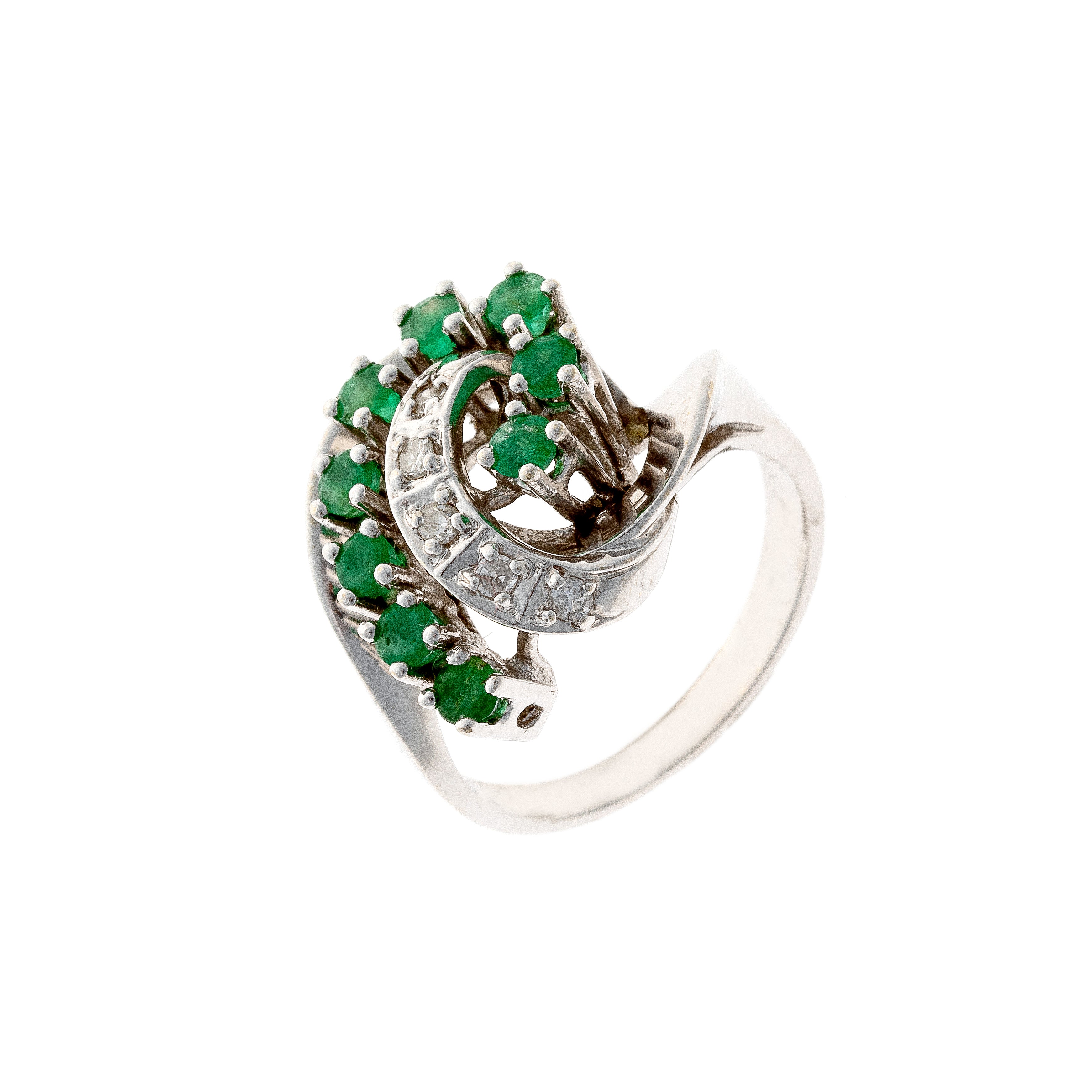 Mid-century white gold cocktail ring with emeralds and diamonds.