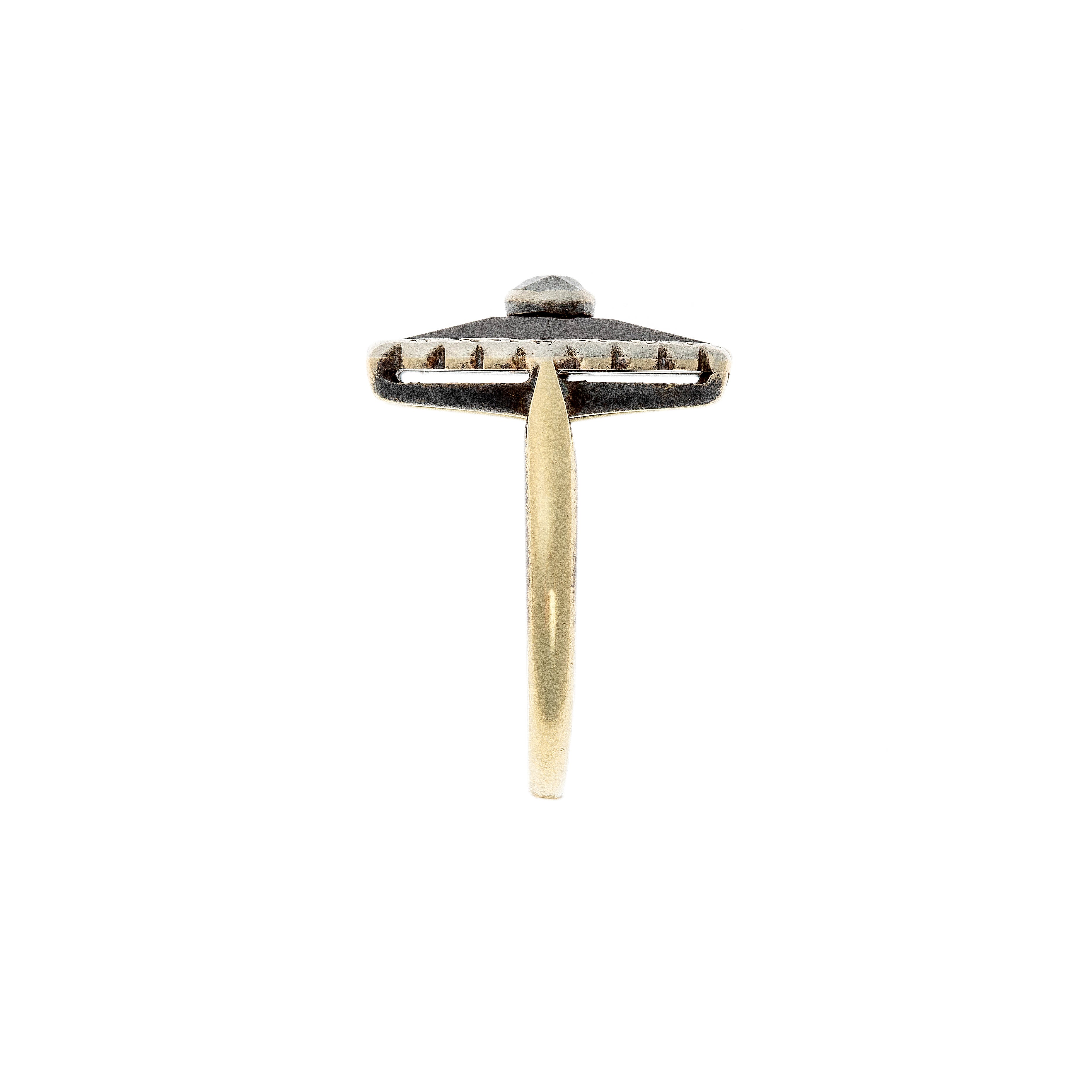 Side profile of a 1920s Dutch Art Deco ring, highlighting the elevated setting and contrast between the black onyx and bright diamond.