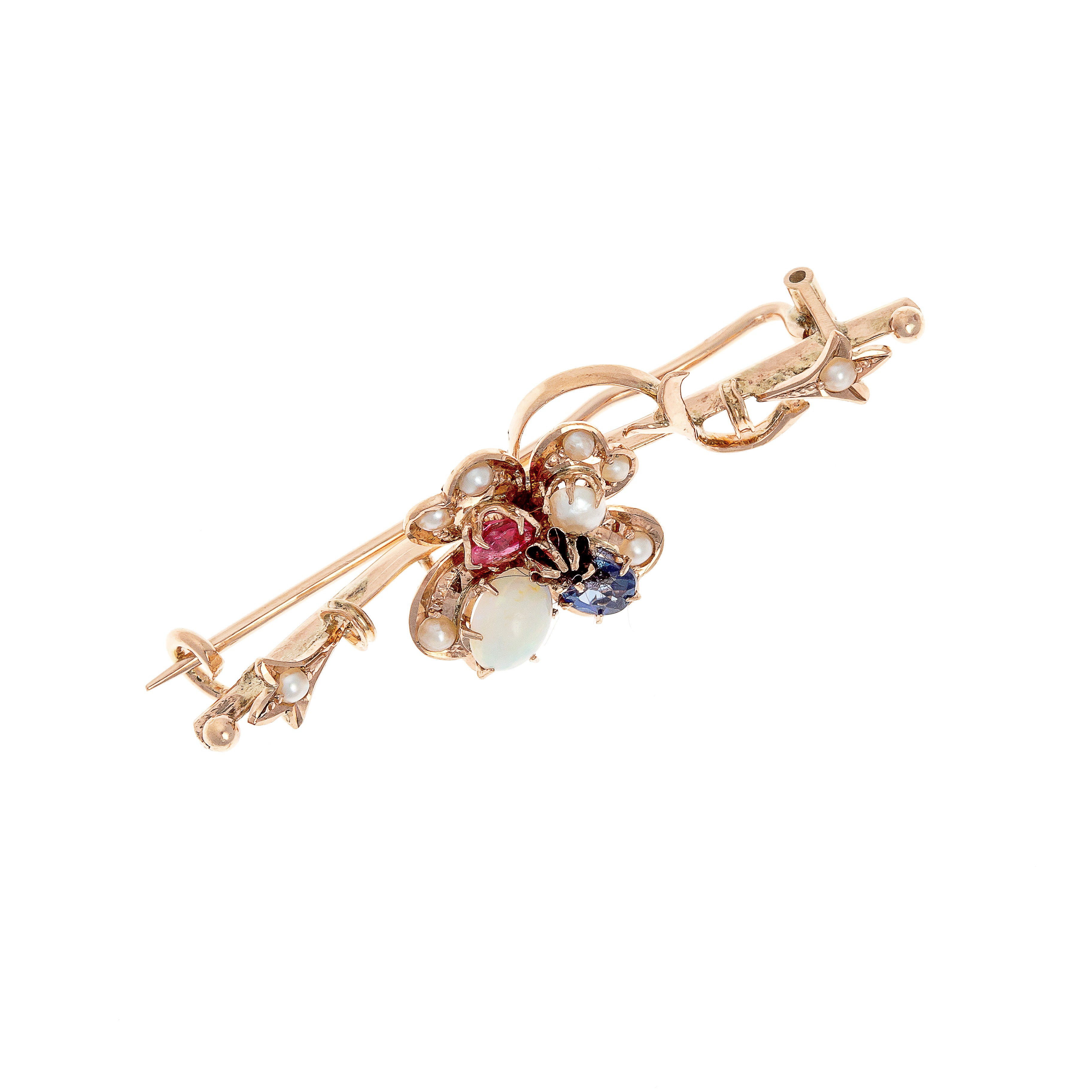 Side view of the Edwardian-era bar brooch, showing delicate gold filigree and gem arrangement.