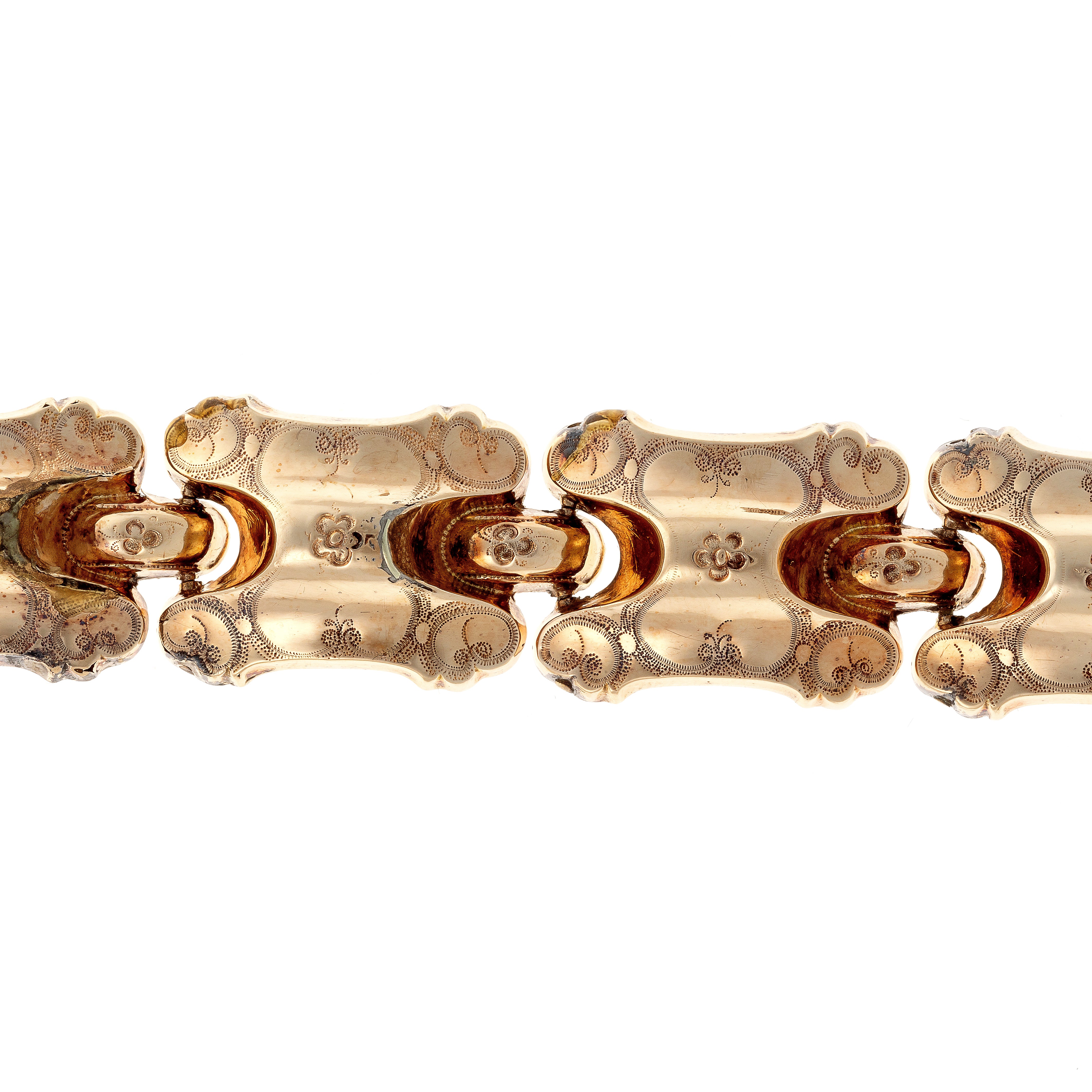 Closeup of the engraving on the antique Victorian gold engraved panel link bracelet.