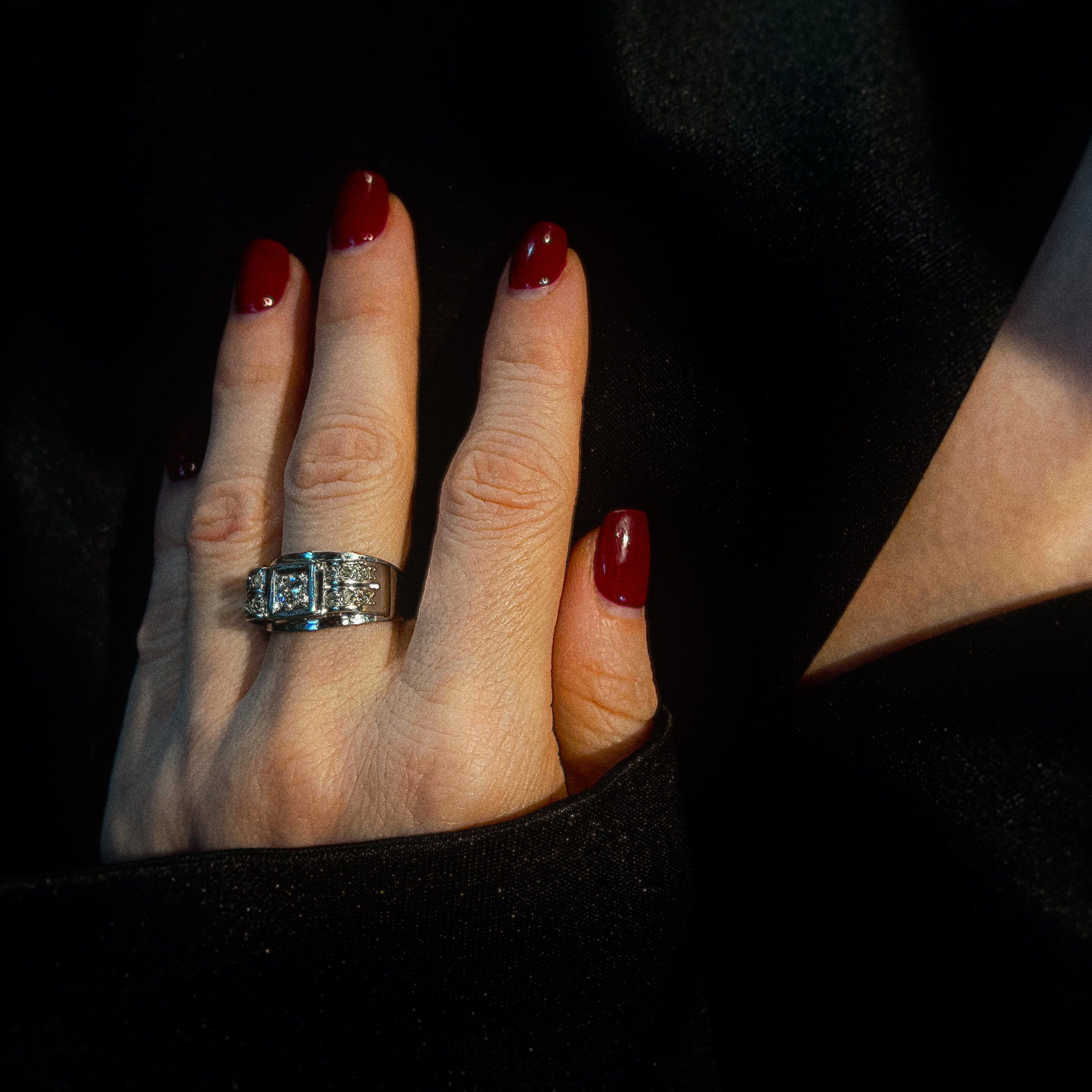 Model wearing the art deco white gold cocktail ring with diamonds.