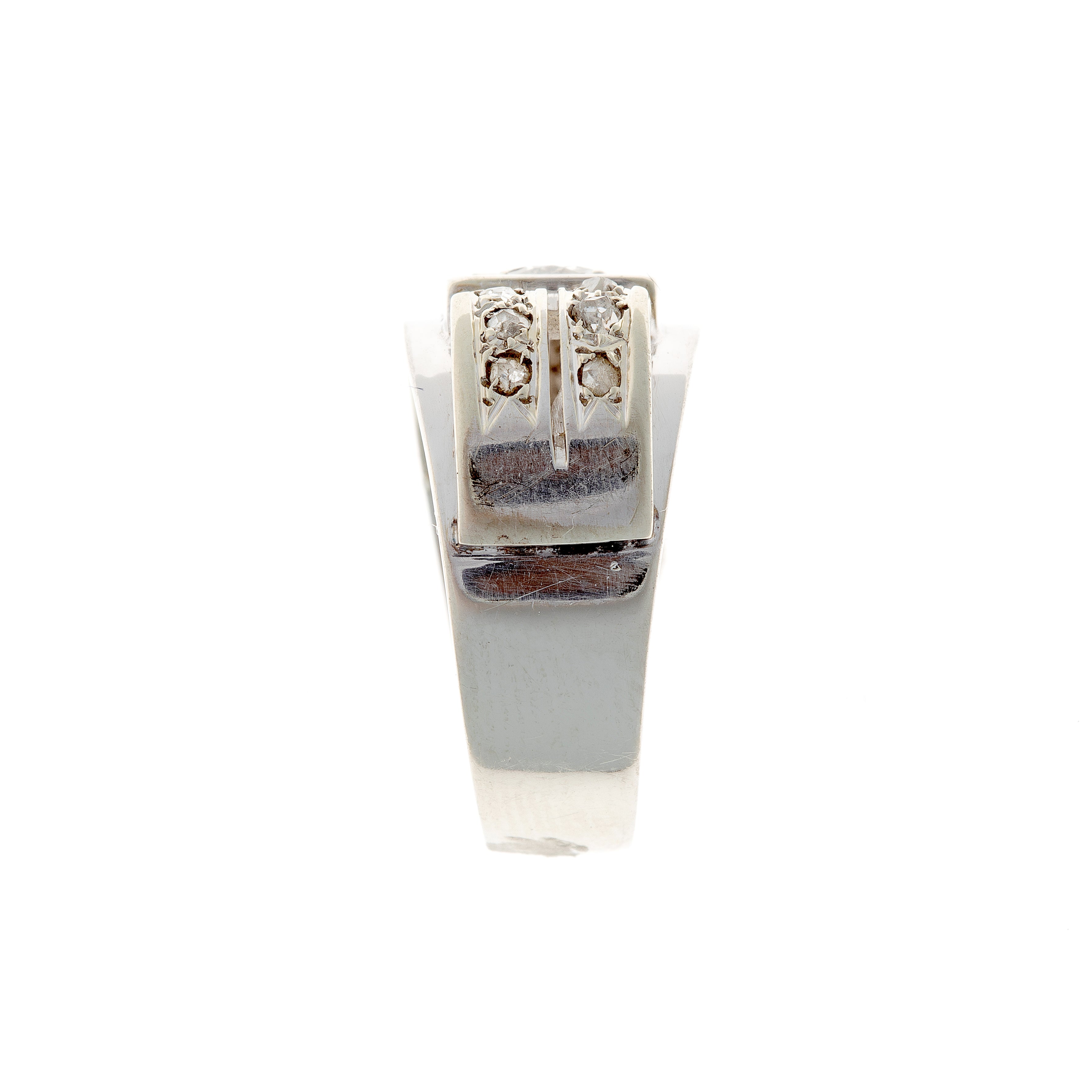Side profile of an Art Deco 18K white gold ring, highlighting its openwork gallery and bold architectural design.