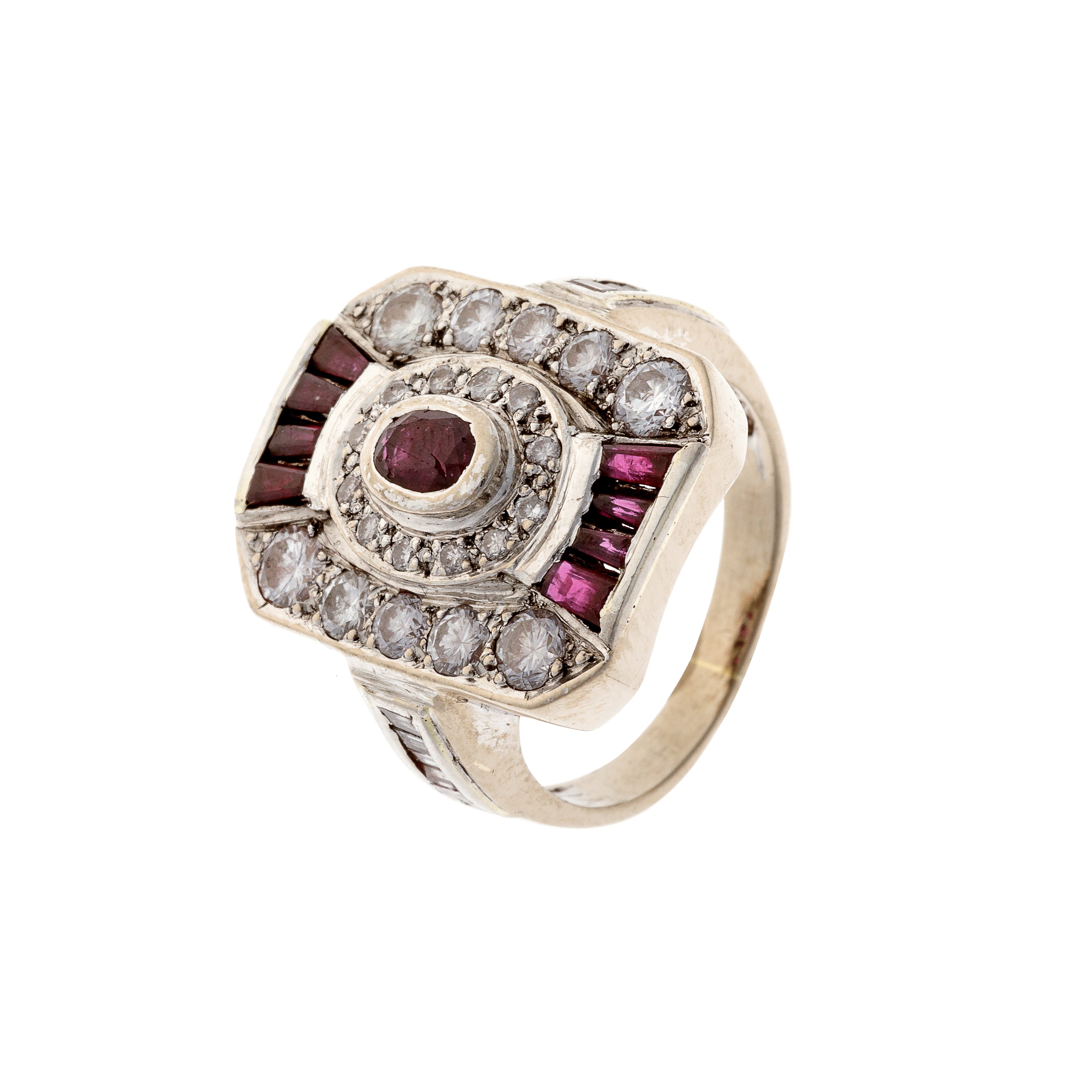 Angled view of Art Deco white gold cocktail ring showcasing ruby and diamond arrangement with tiered detailing.