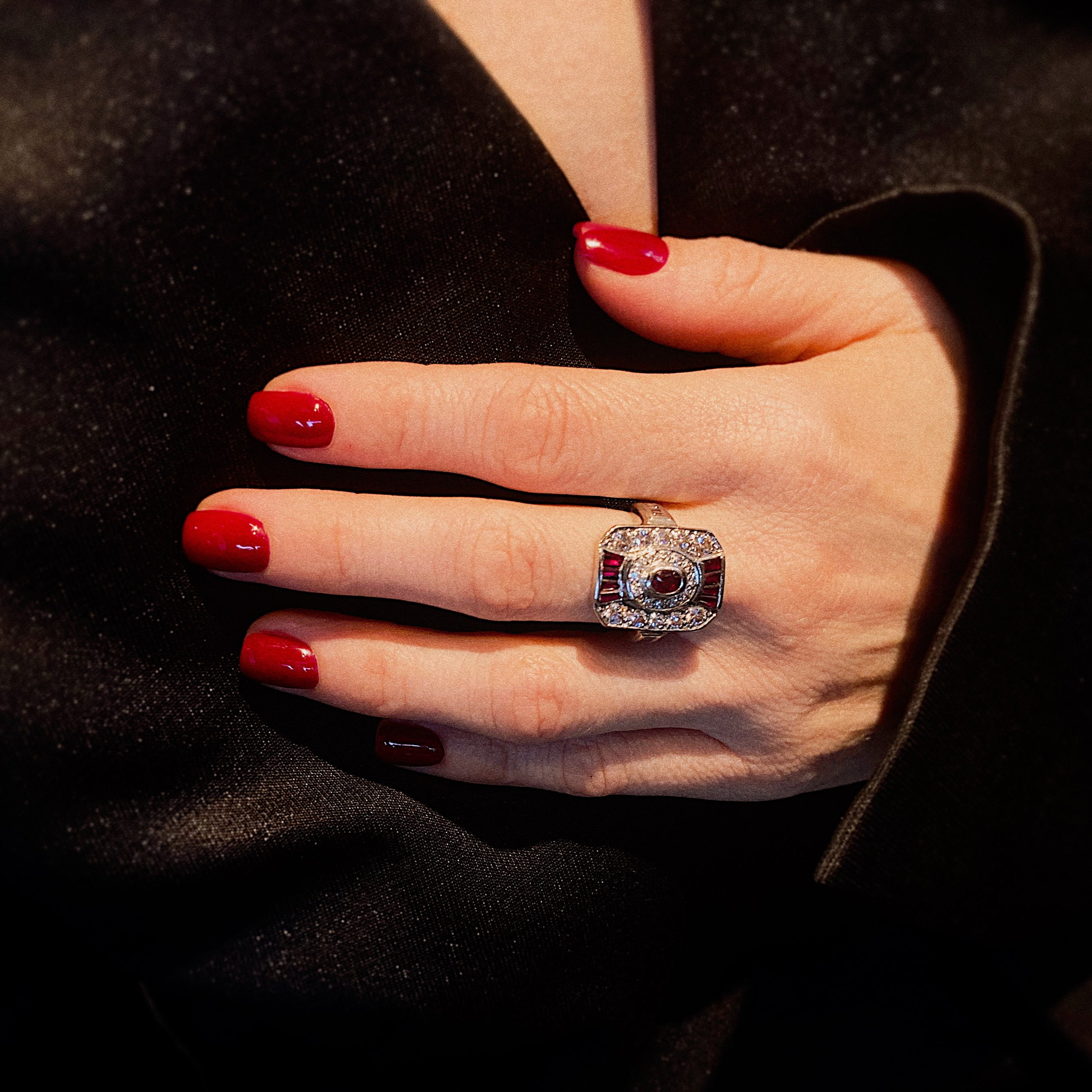 Model wearing the art deco white gold ruby and diamond cocktail statement ring.