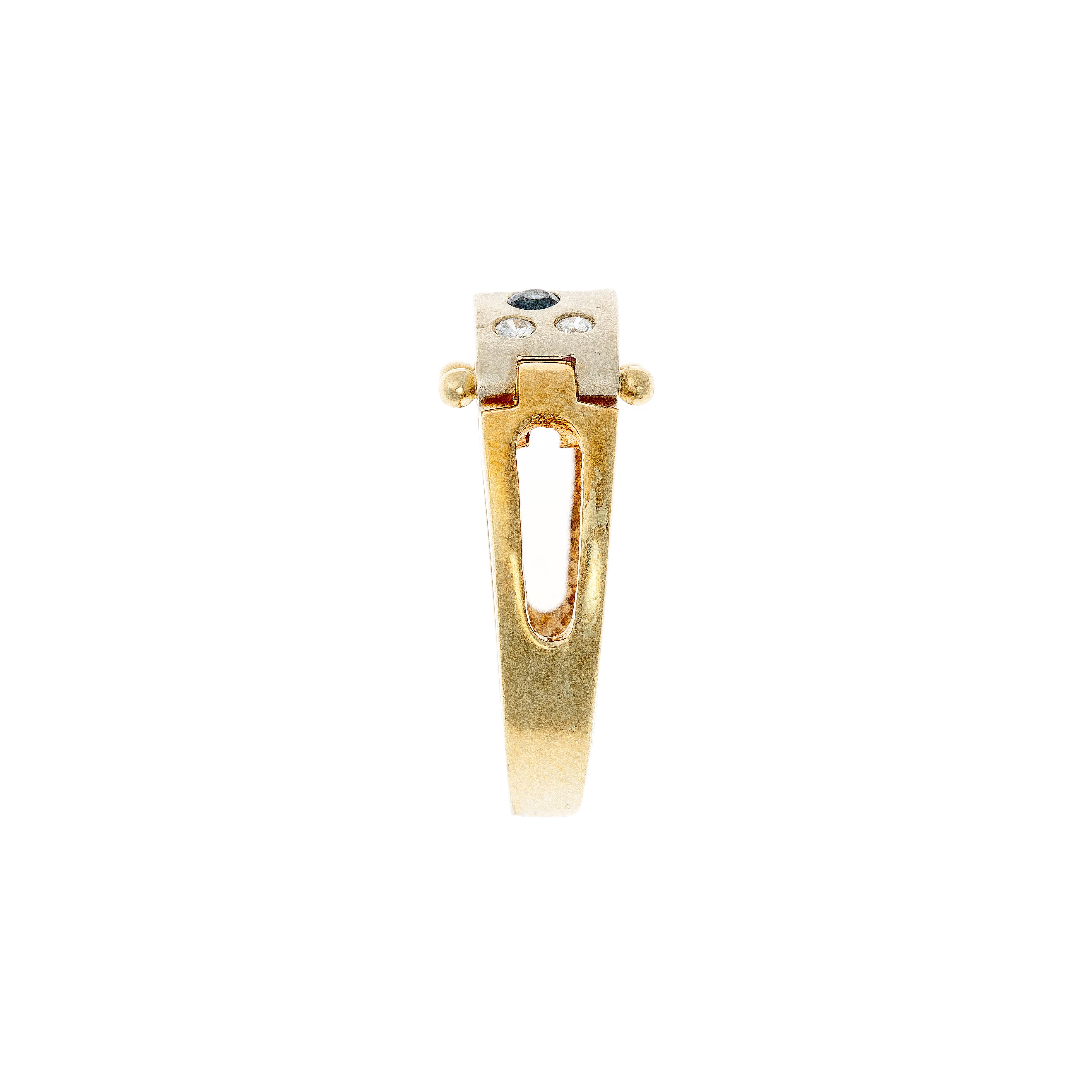 Side profile of an Avant-Garde two-tone gold ring with openwork cutouts and riveted details.