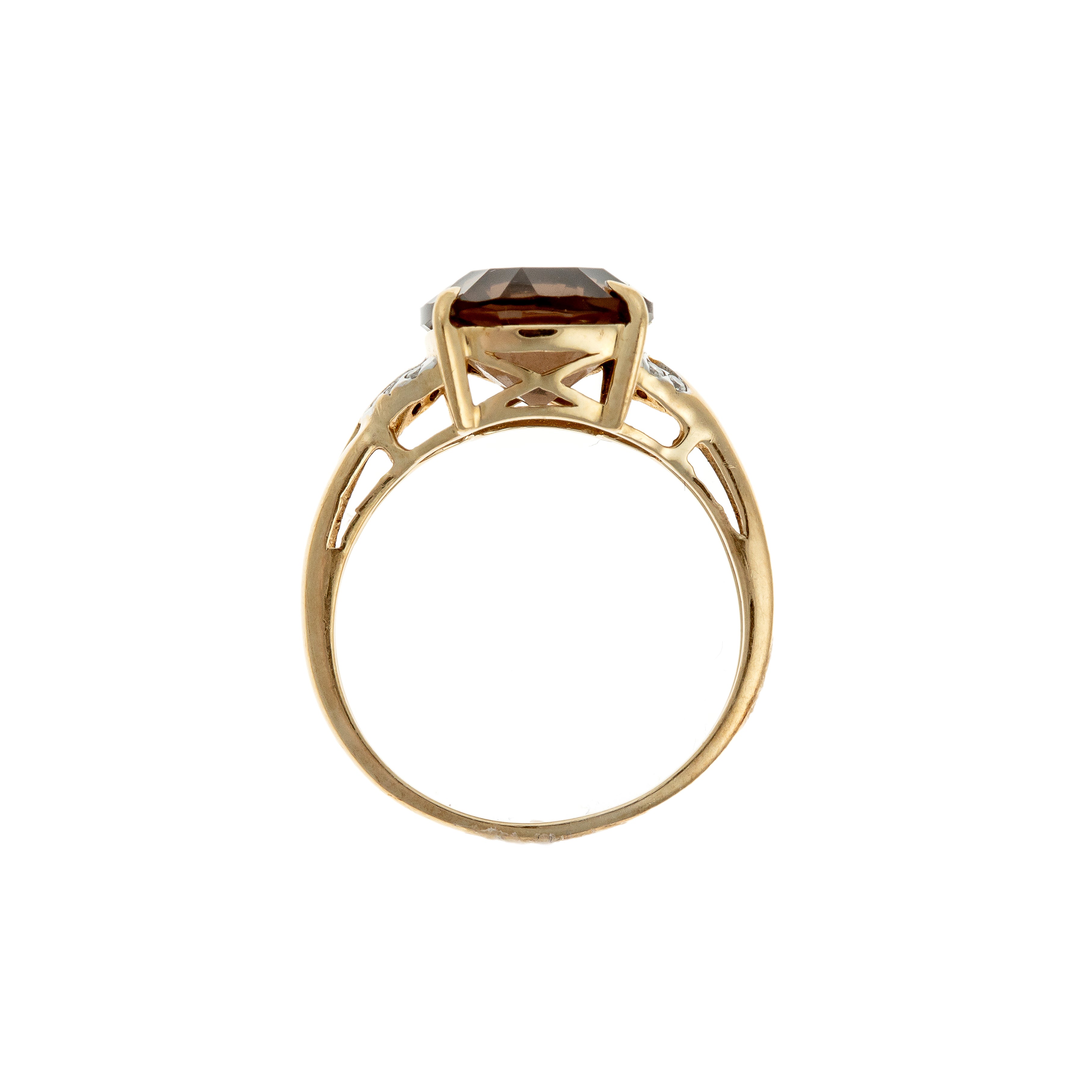 Profile shot emphasizing the ring’s elegant prong setting and filigree under-gallery in 9k gold.