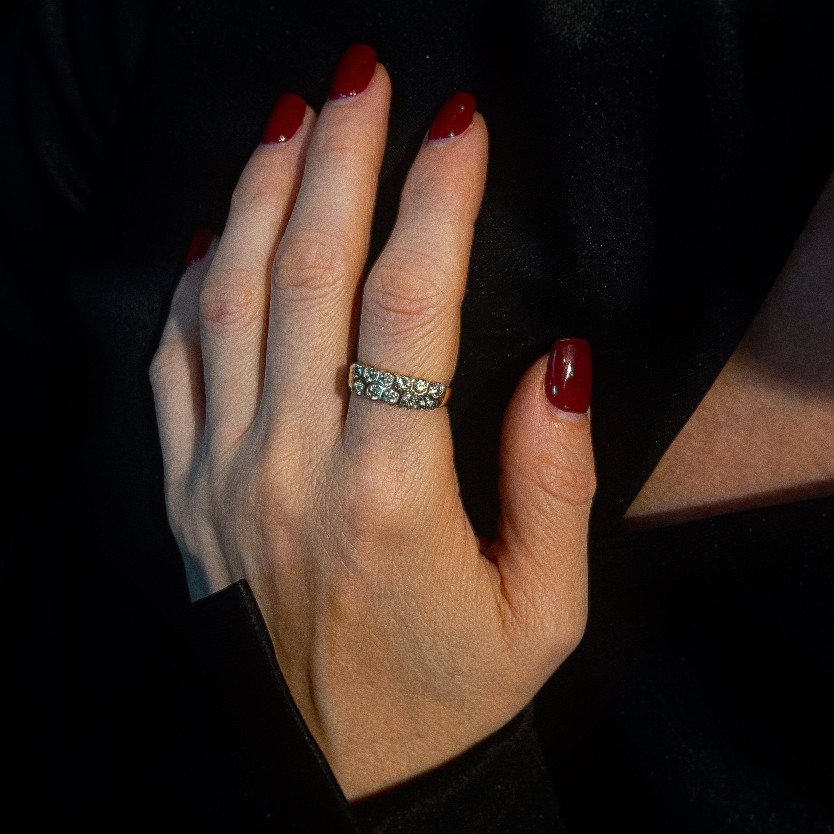 Model wearing the brutalist vintage gold cocktail ring with peridots.
