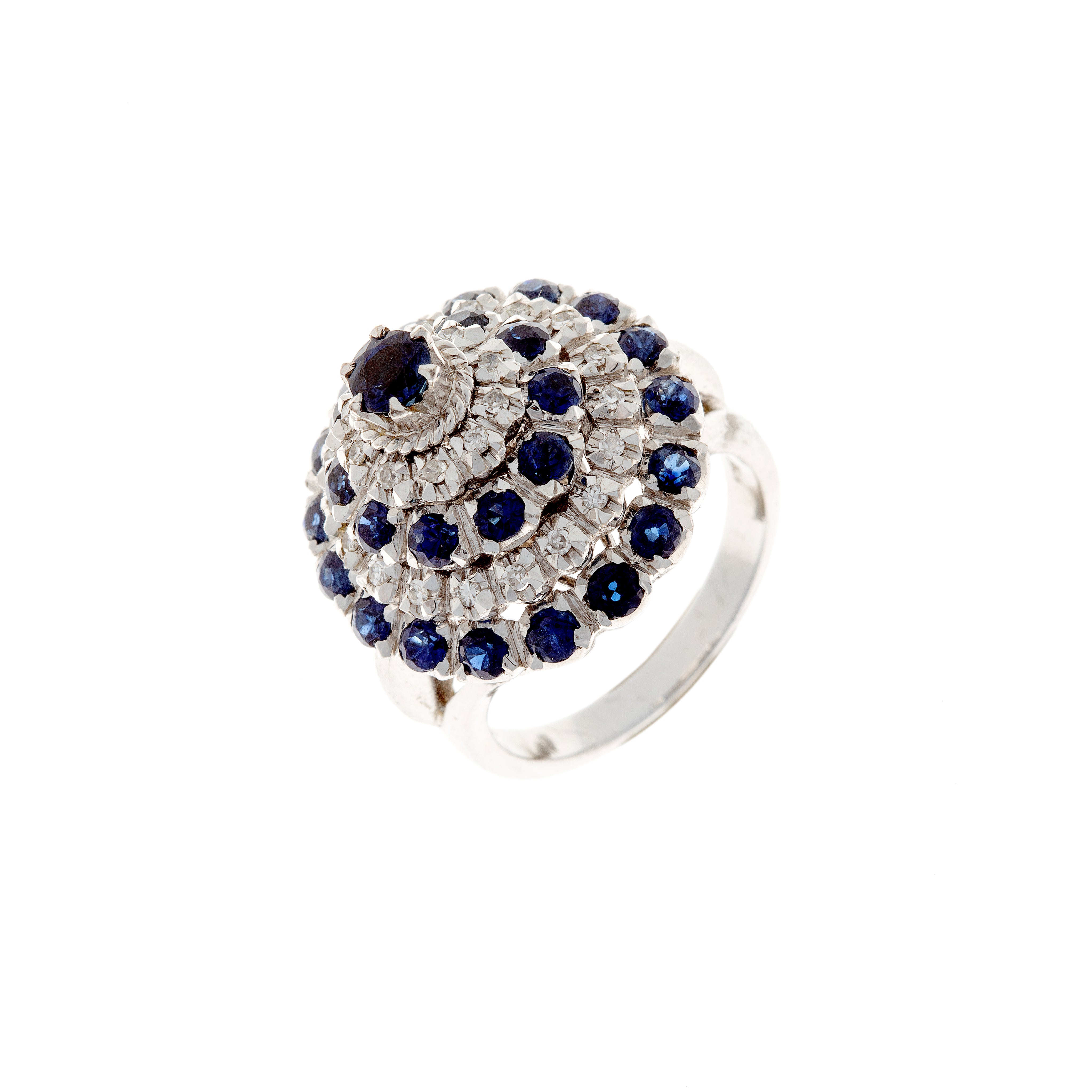 Angled view of contemporary white gold ring with sapphire and diamond rosettes.