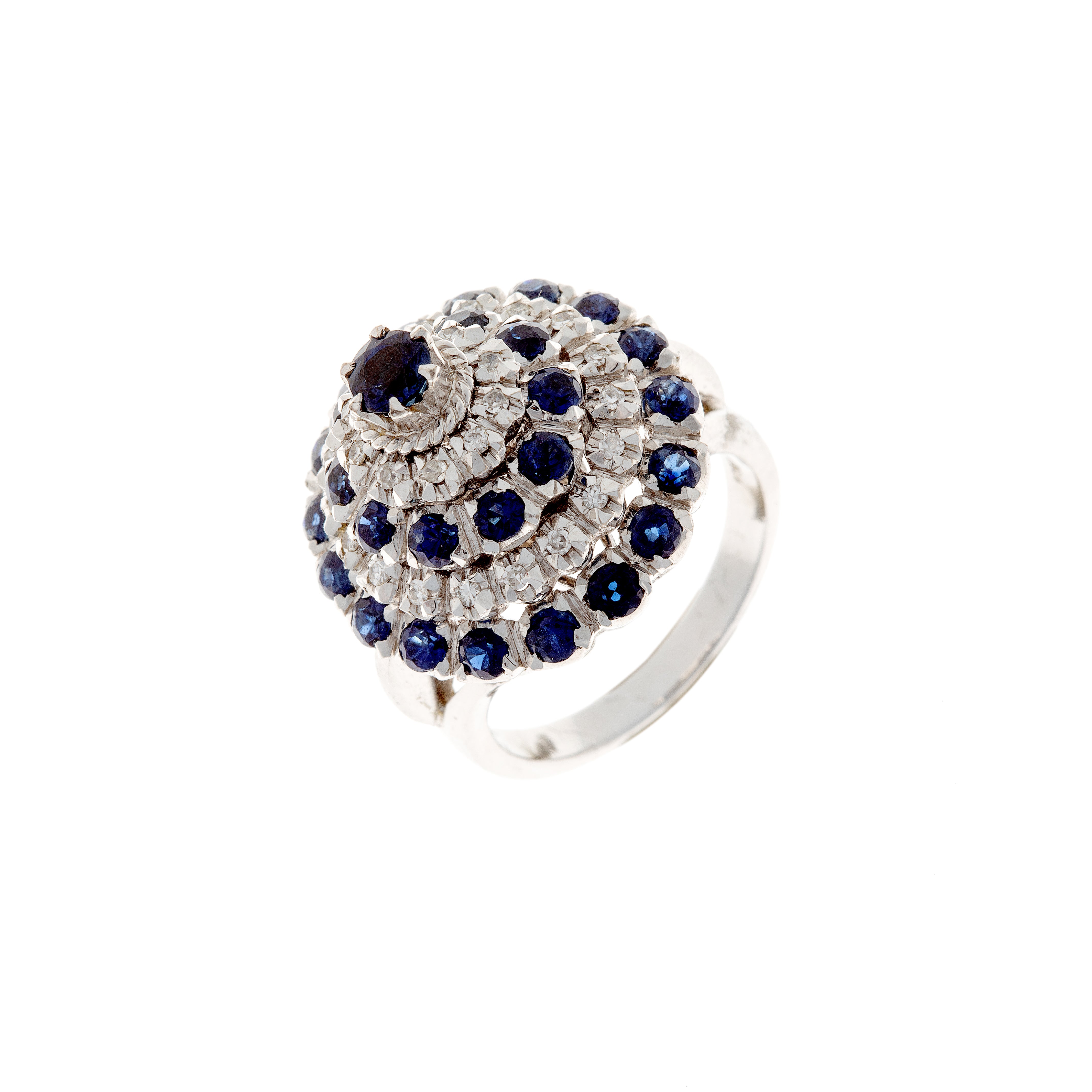 Angled view of contemporary white gold ring with sapphire and diamond rosettes.