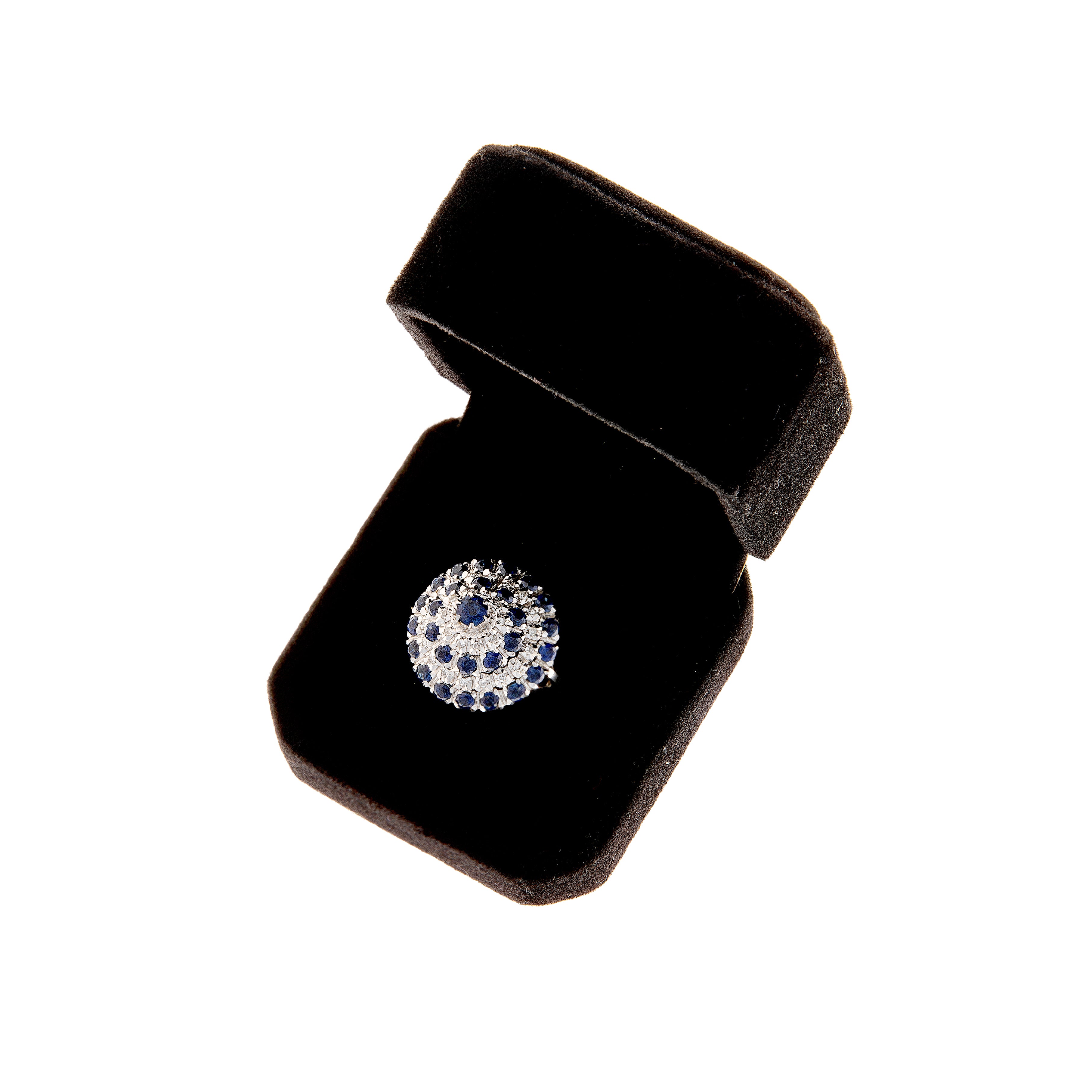Elegant cluster ring in sapphire and diamond presented in luxury display box.