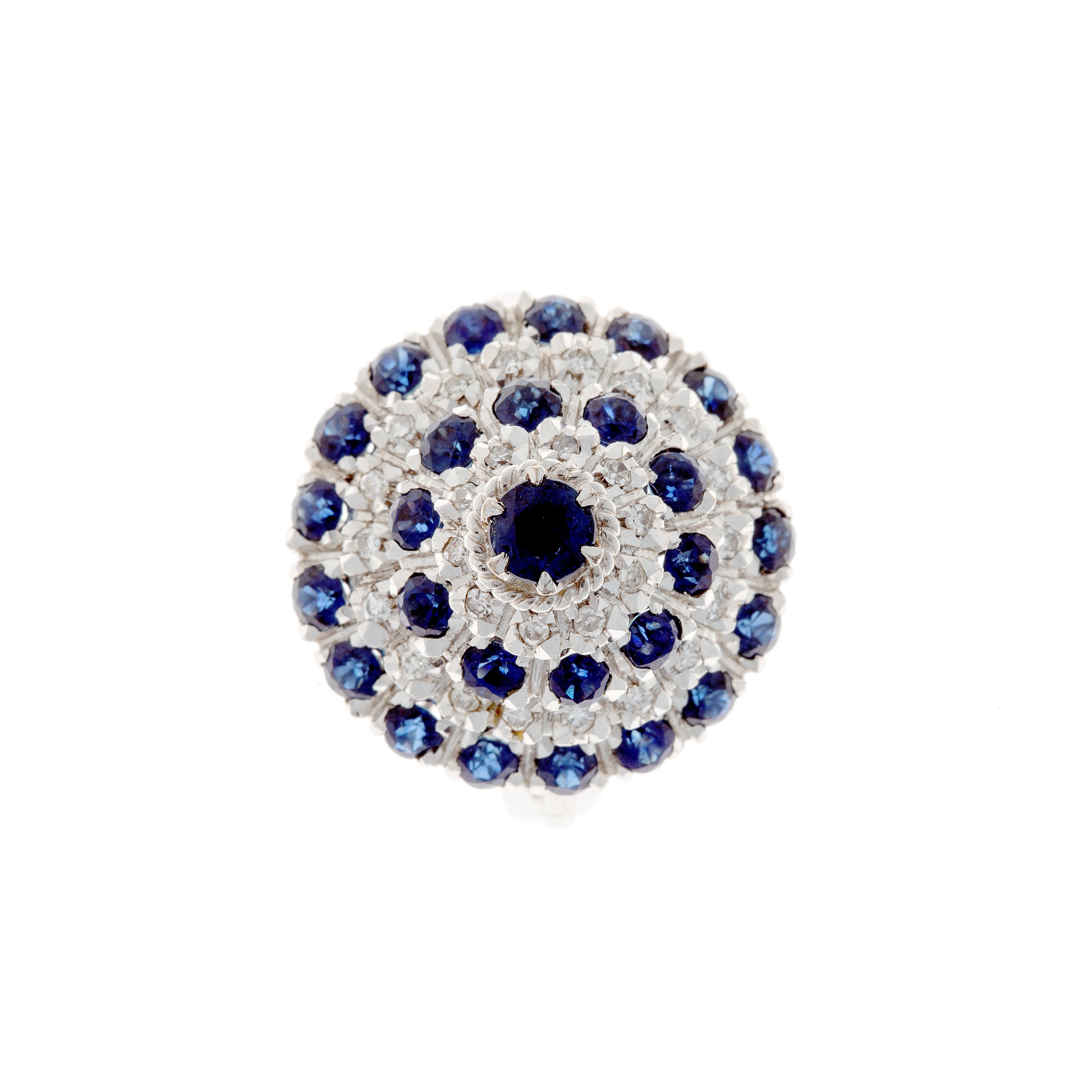 Contemporary vintage white gold cluster cocktail ring with blue sapphires and diamonds.