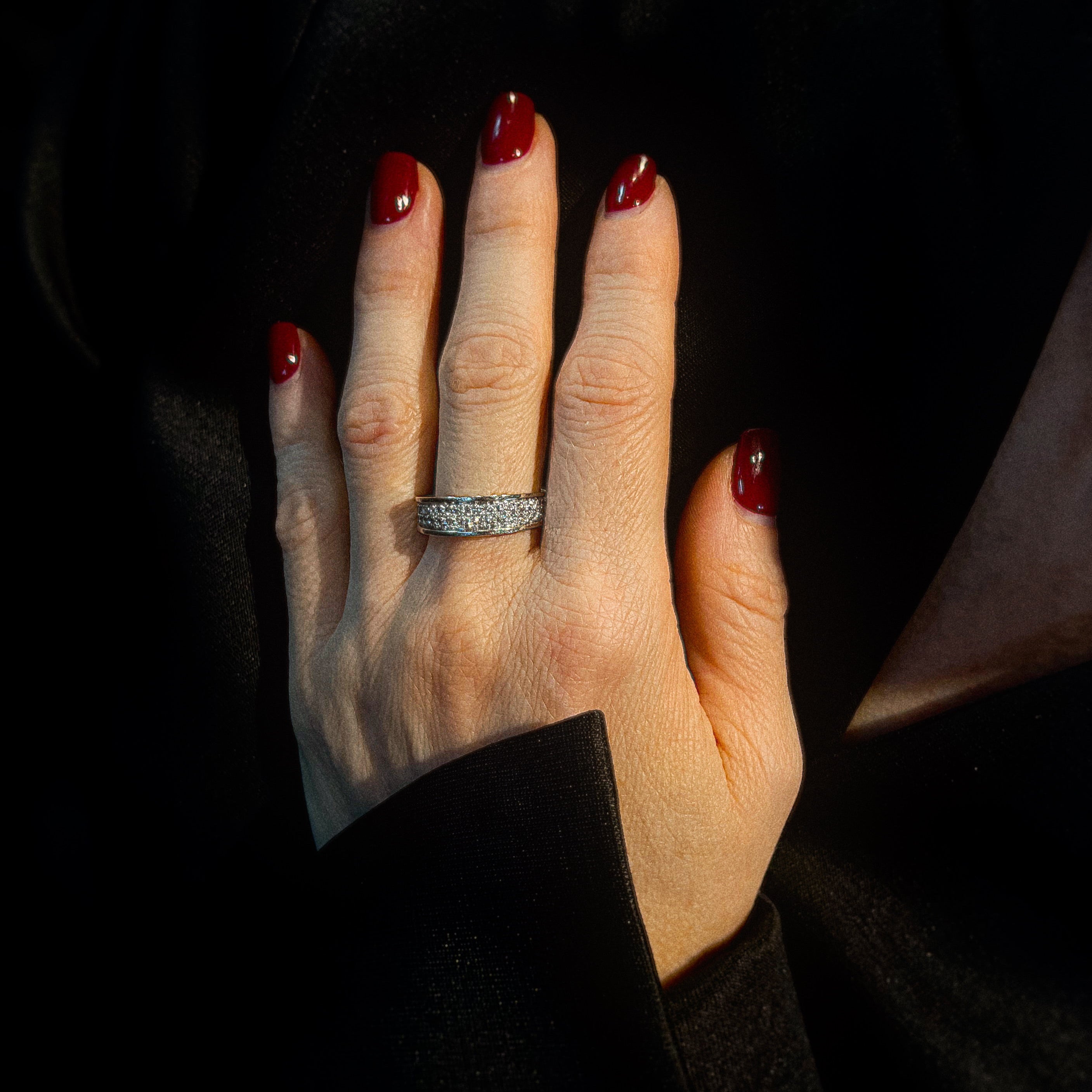 Model wearing the vintage white gold eternity ring with pave-set diamonds.