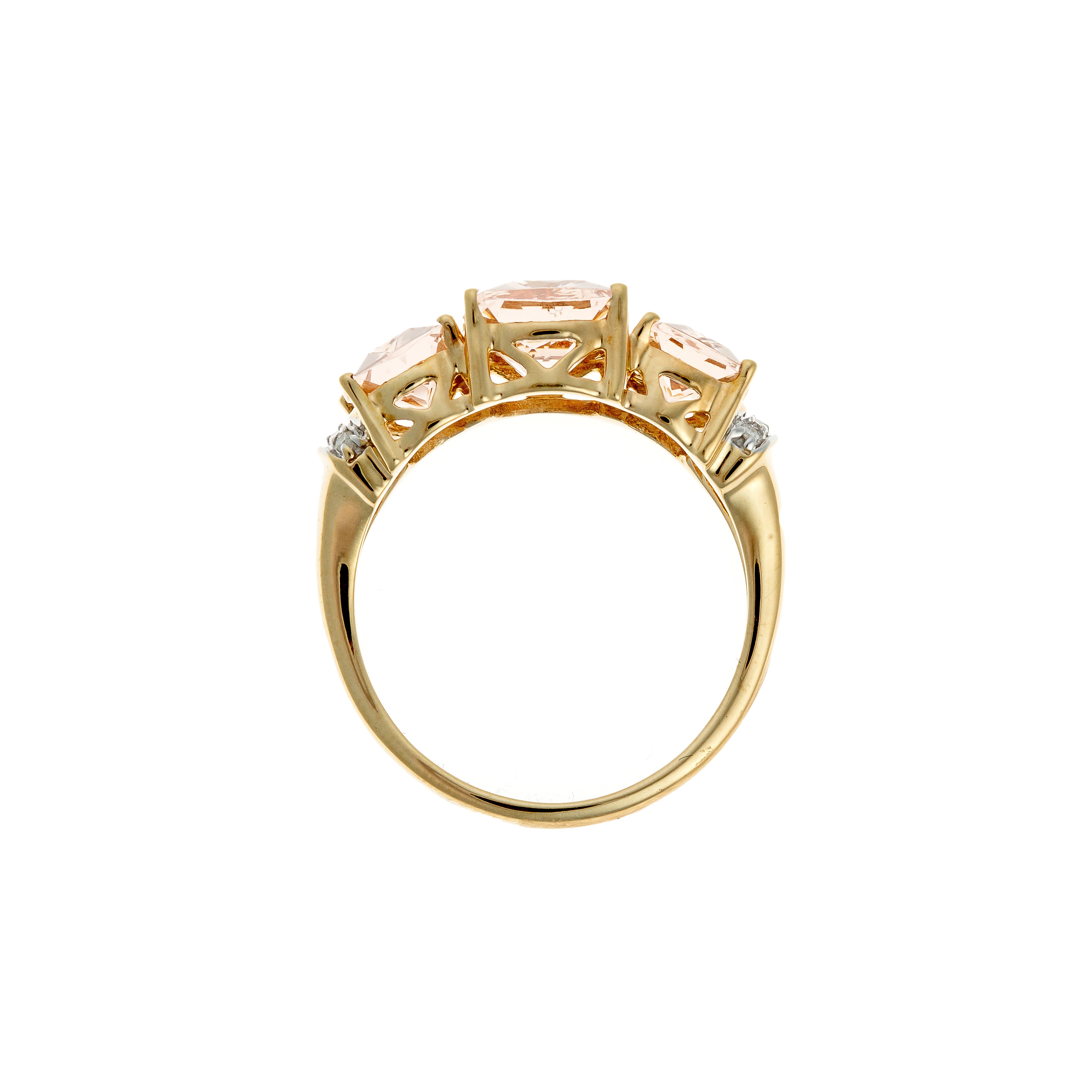 Profile view of contemporary vintage gold cocktail ring with pink morganites and small diamonds set in openwork gallery.