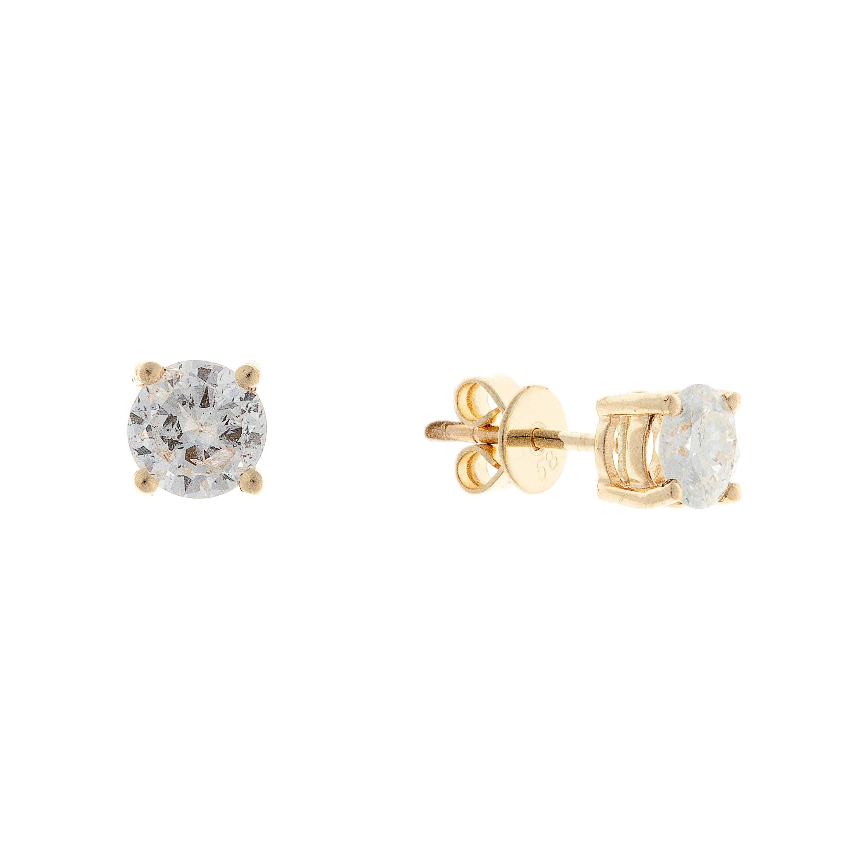 Angled view of minimalist 14K gold diamond studs showing butterfly backs and clean prong design.