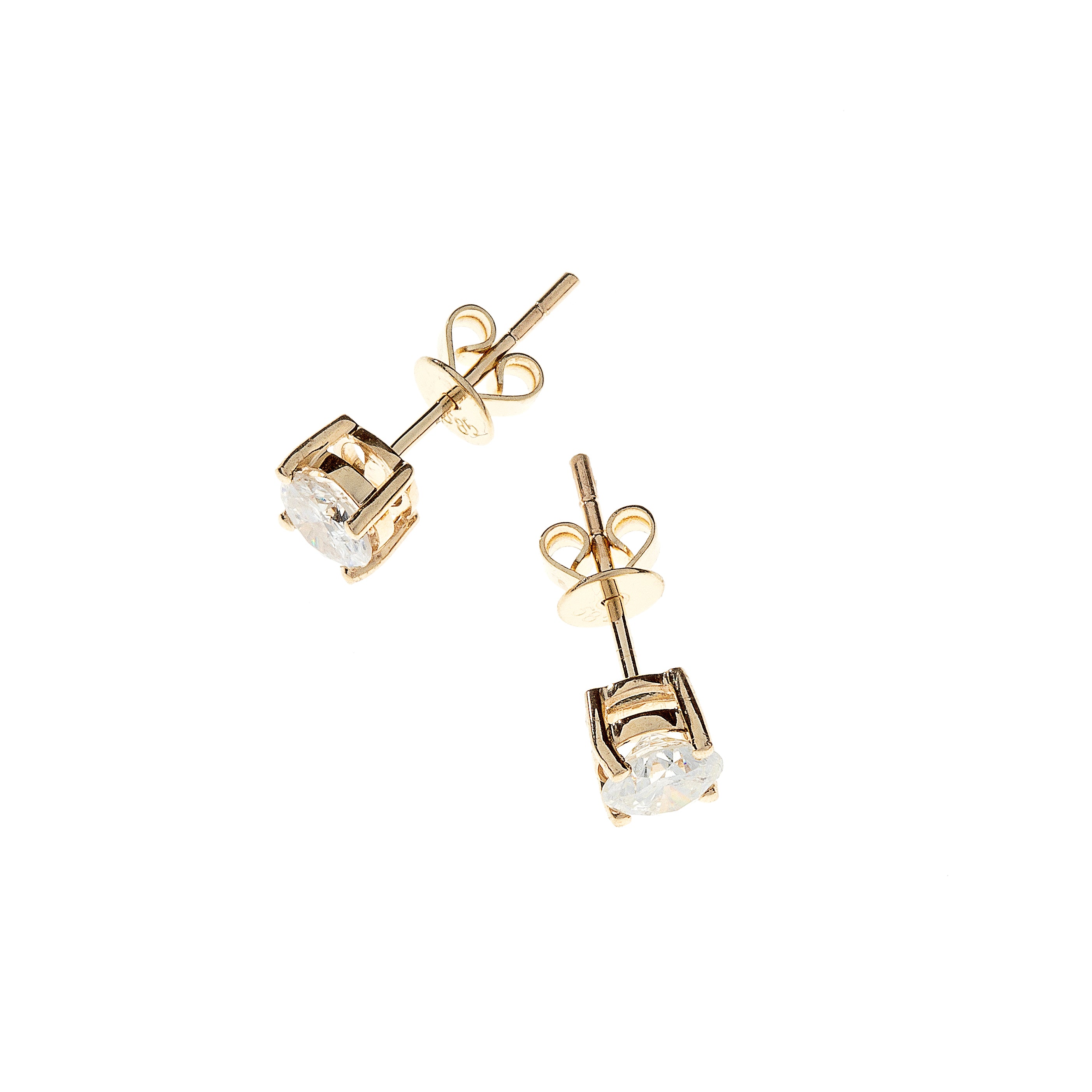 Top view showing symmetrical alignment of brilliant-cut diamonds in gold stud earrings.