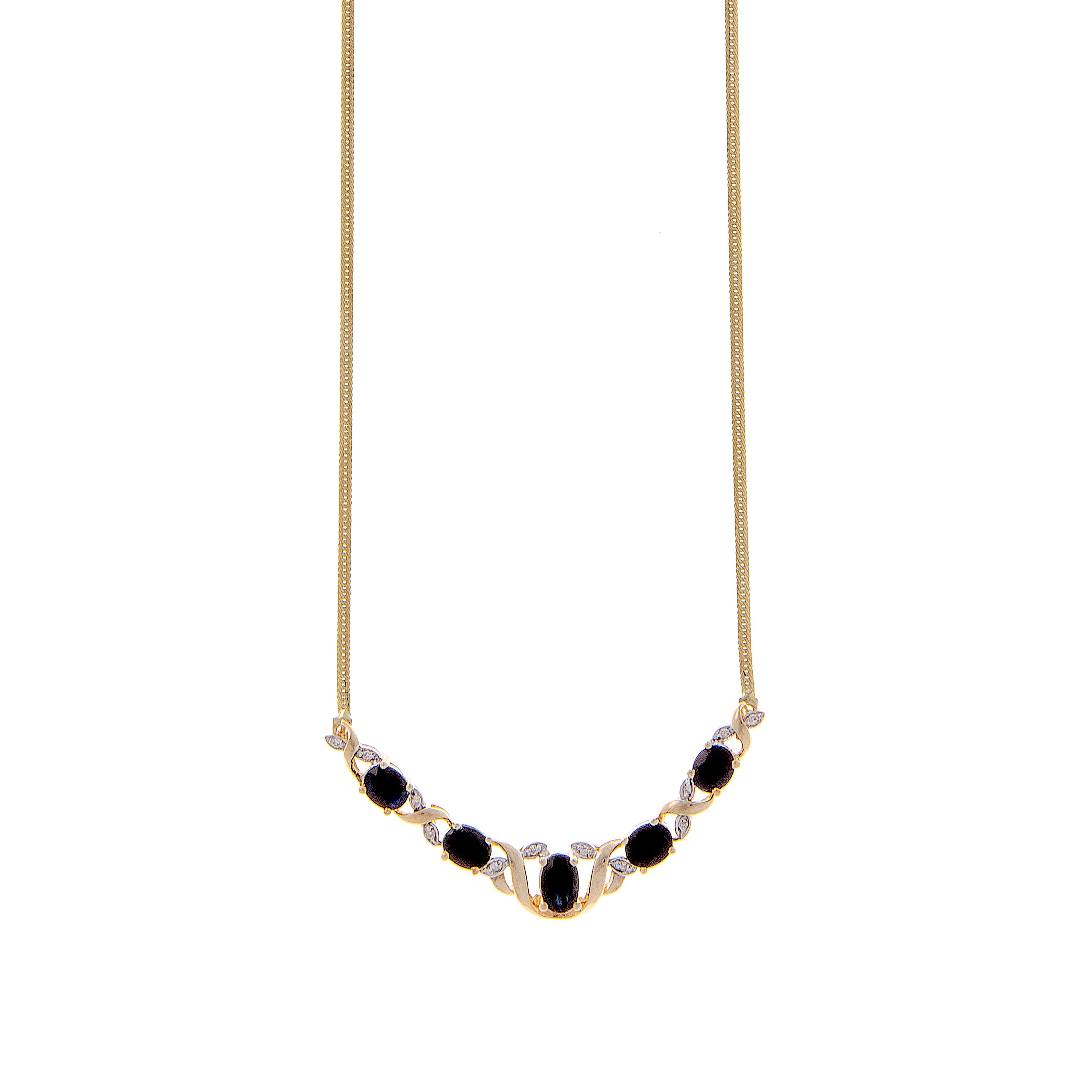 Flat lay of refined gold necklace with evenly spaced sapphire and diamond-set pendants, designed in a graceful tapering arc.