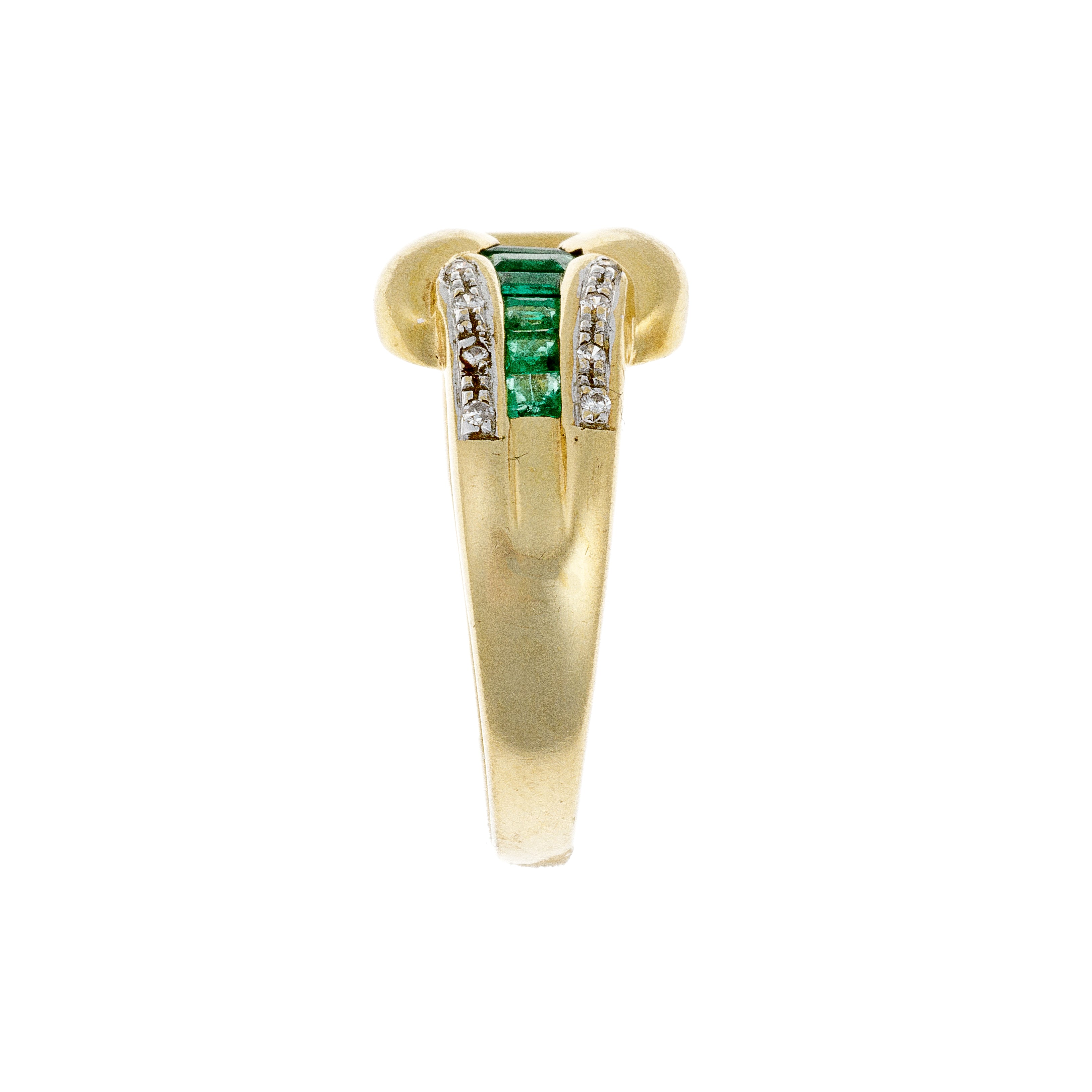 Side view of contemporary vintage gold cocktail ring with diamonds and emeralds.