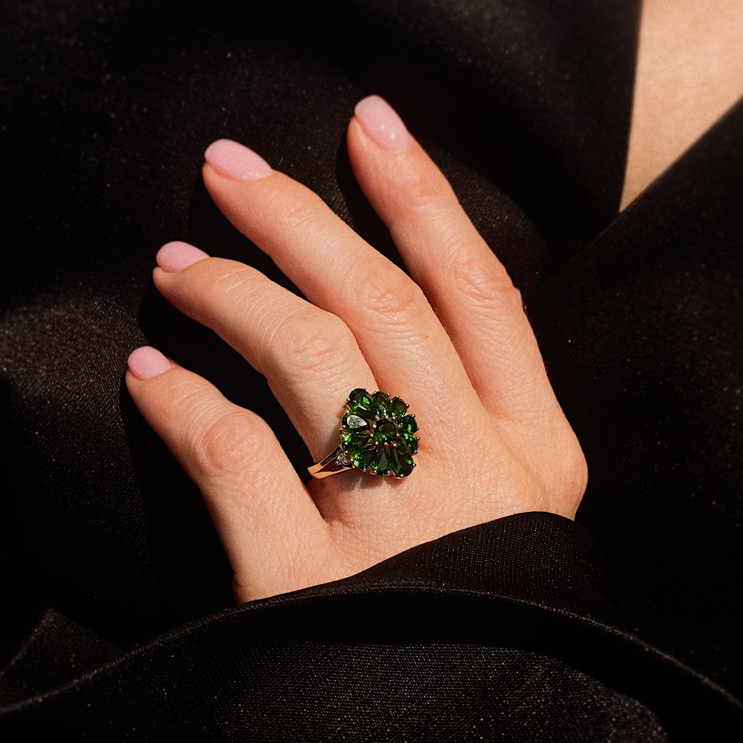 Model hand wearing the contemporary vintage Harry Ivens gold cocktail ring with chromdiopsides.