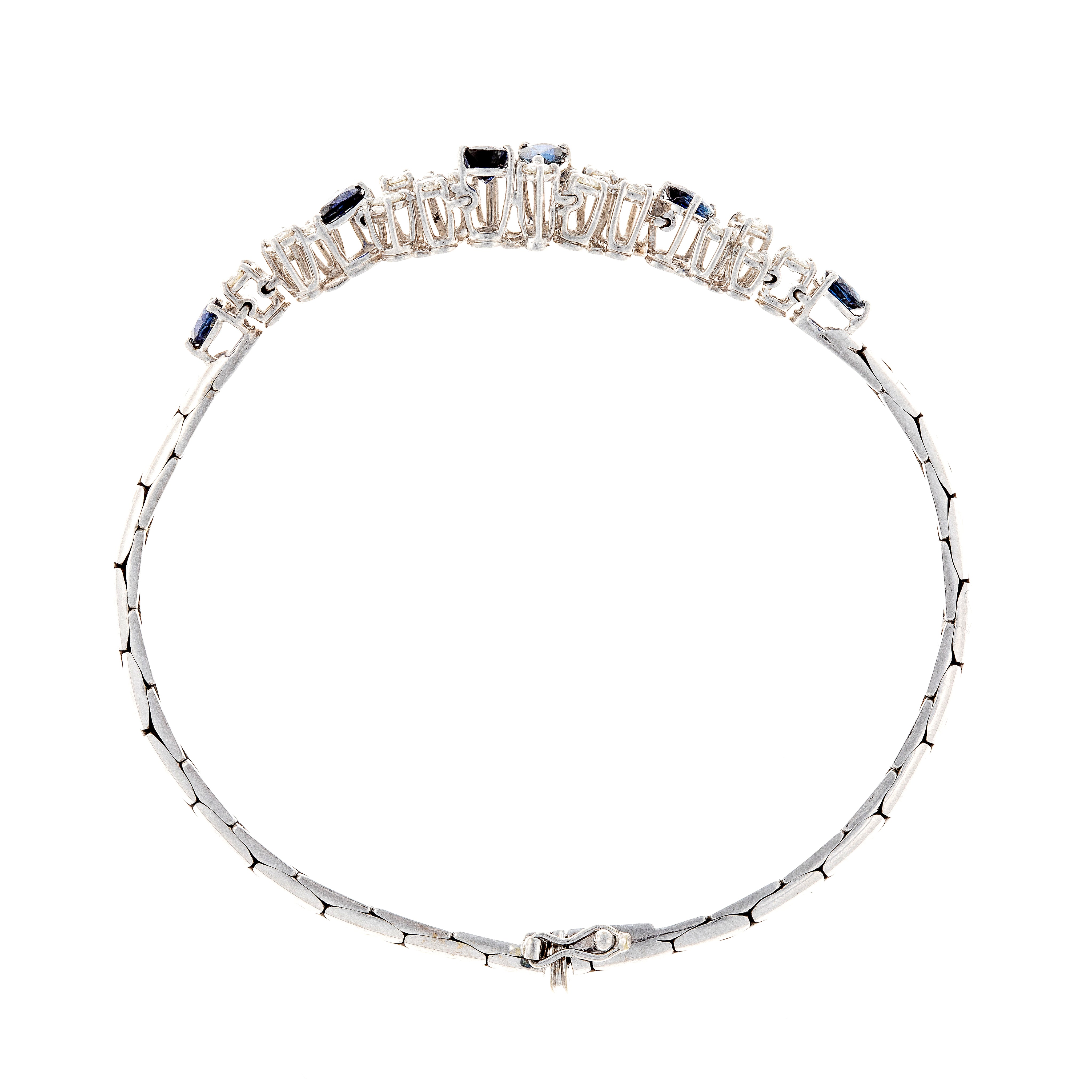 Bottom view of contemporary vintage white gold bracelet with sapphires and diamonds.