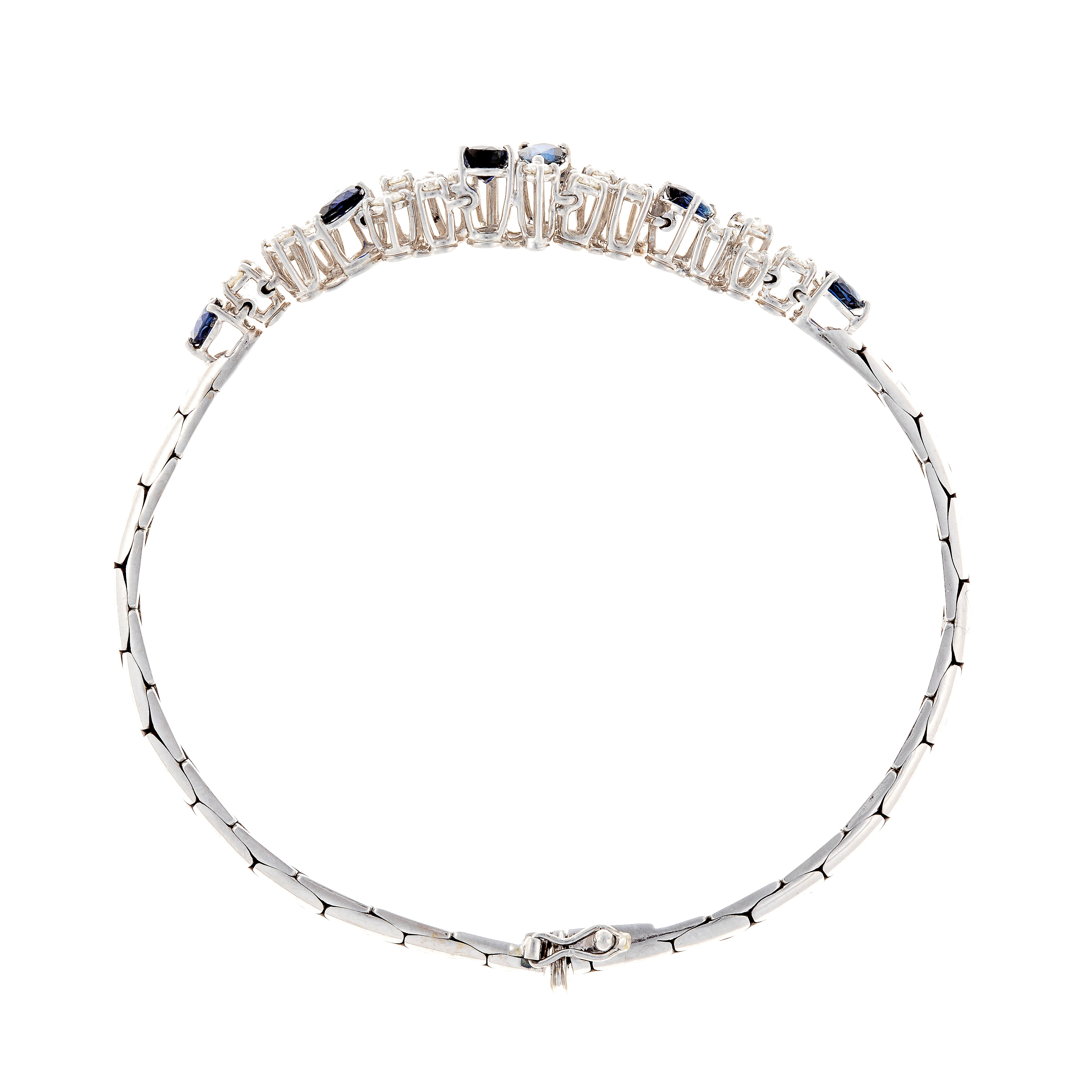 Bottom view of contemporary vintage white gold bracelet with sapphires and diamonds.