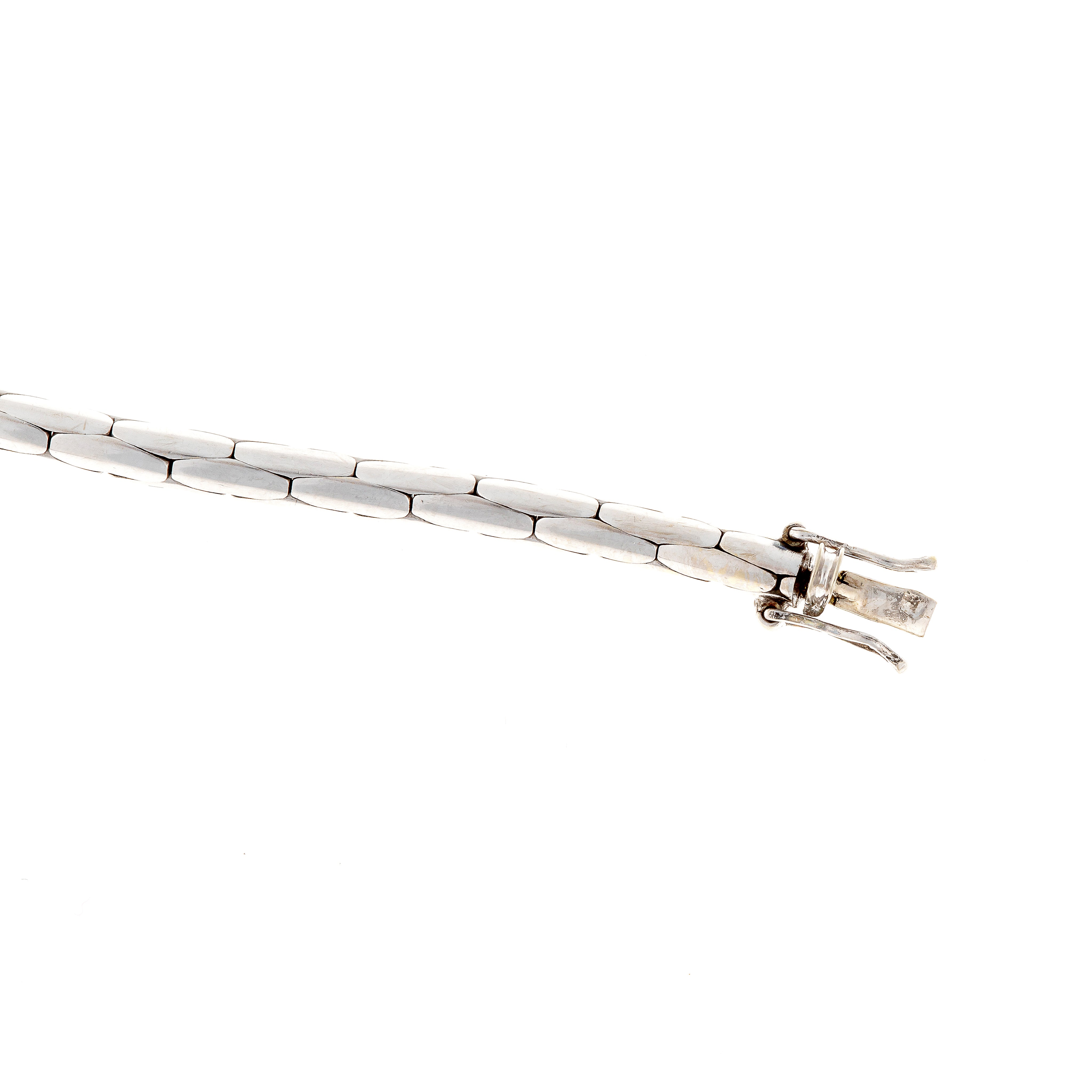 Clasp detail of contemporary vintage white gold sapphire and diamond bracelet.