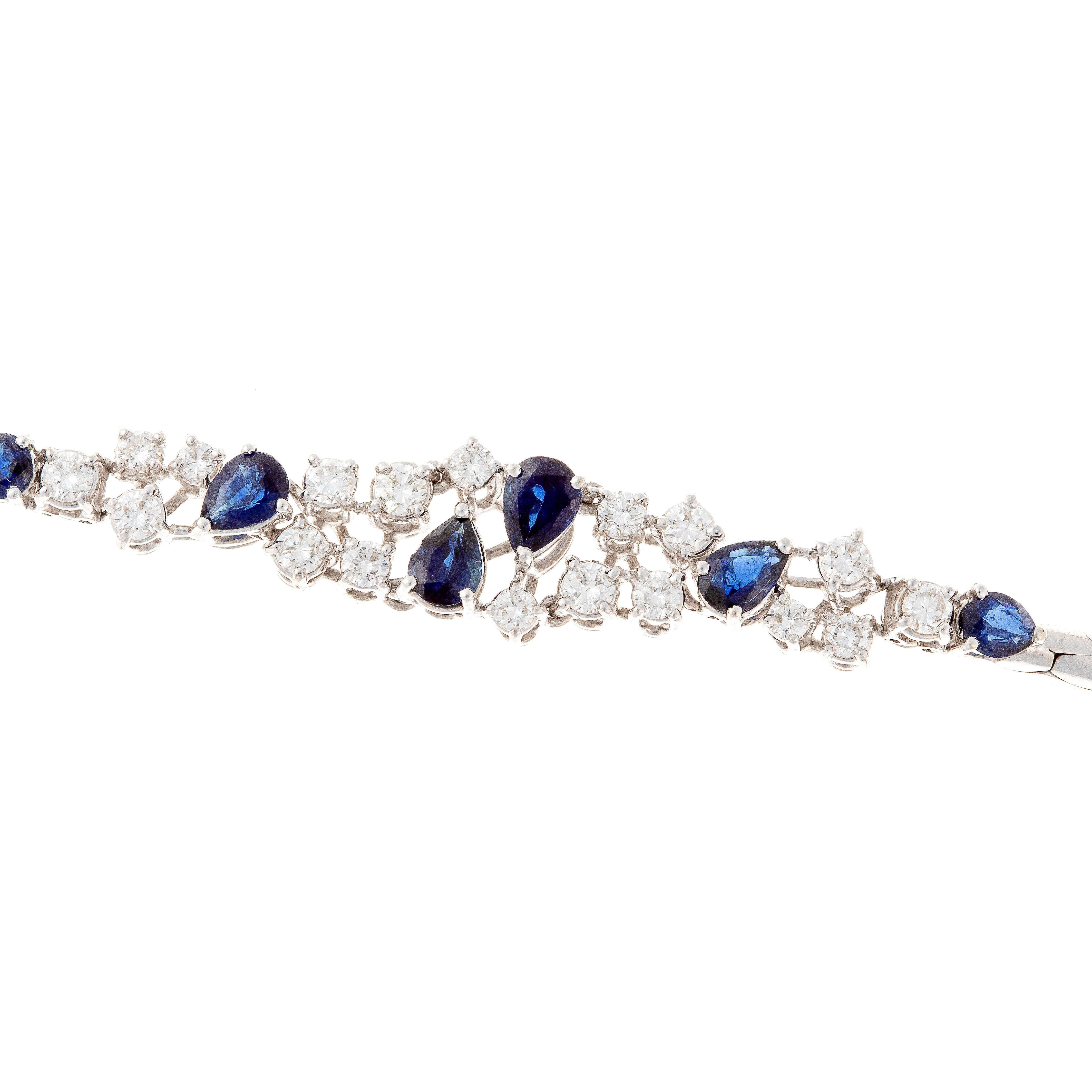 Detail view of sapphires and diamonds on contemporary vintage white gold bracelet.
