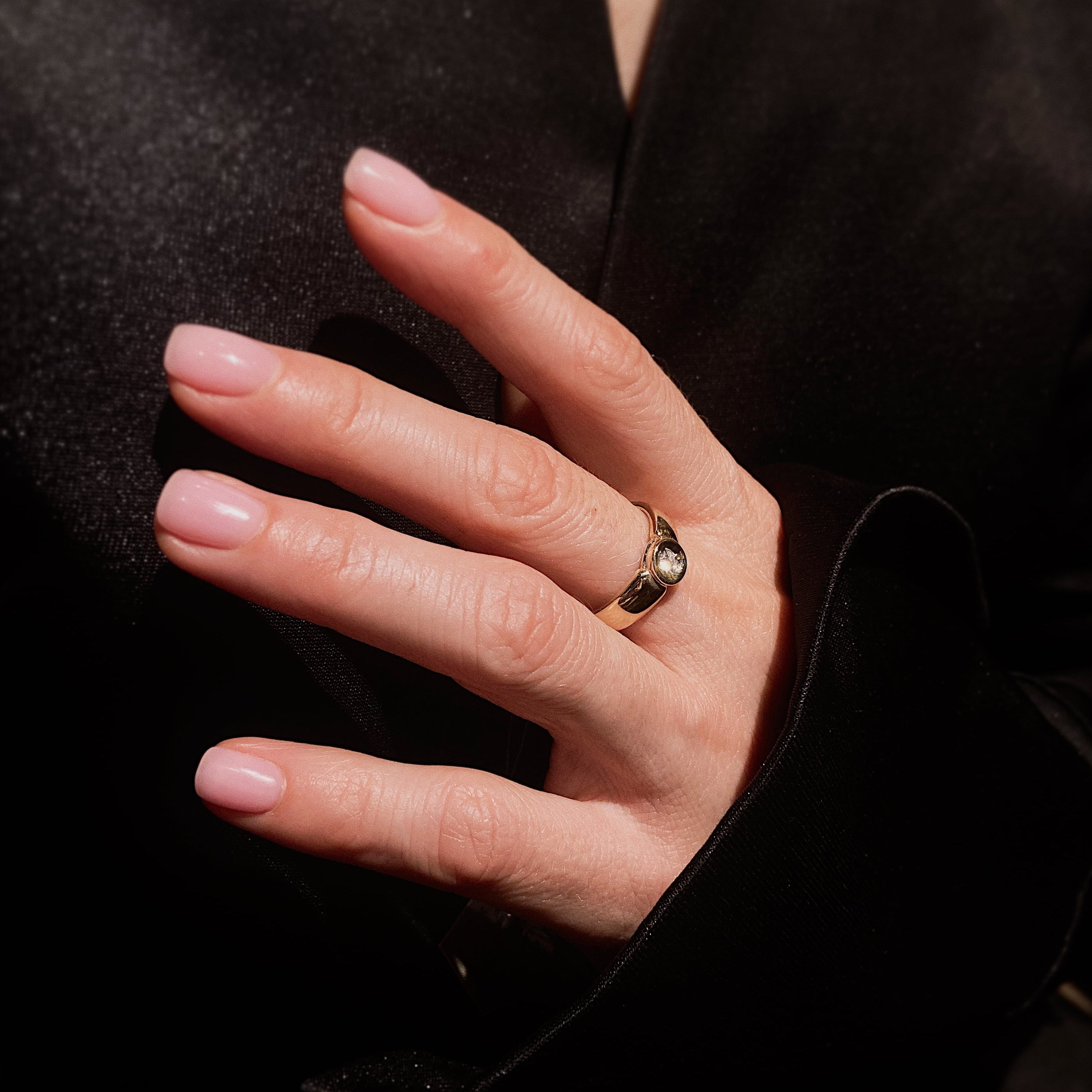 Woman wearing the contemporary vintage two-tone gold diamond solitaire ring.