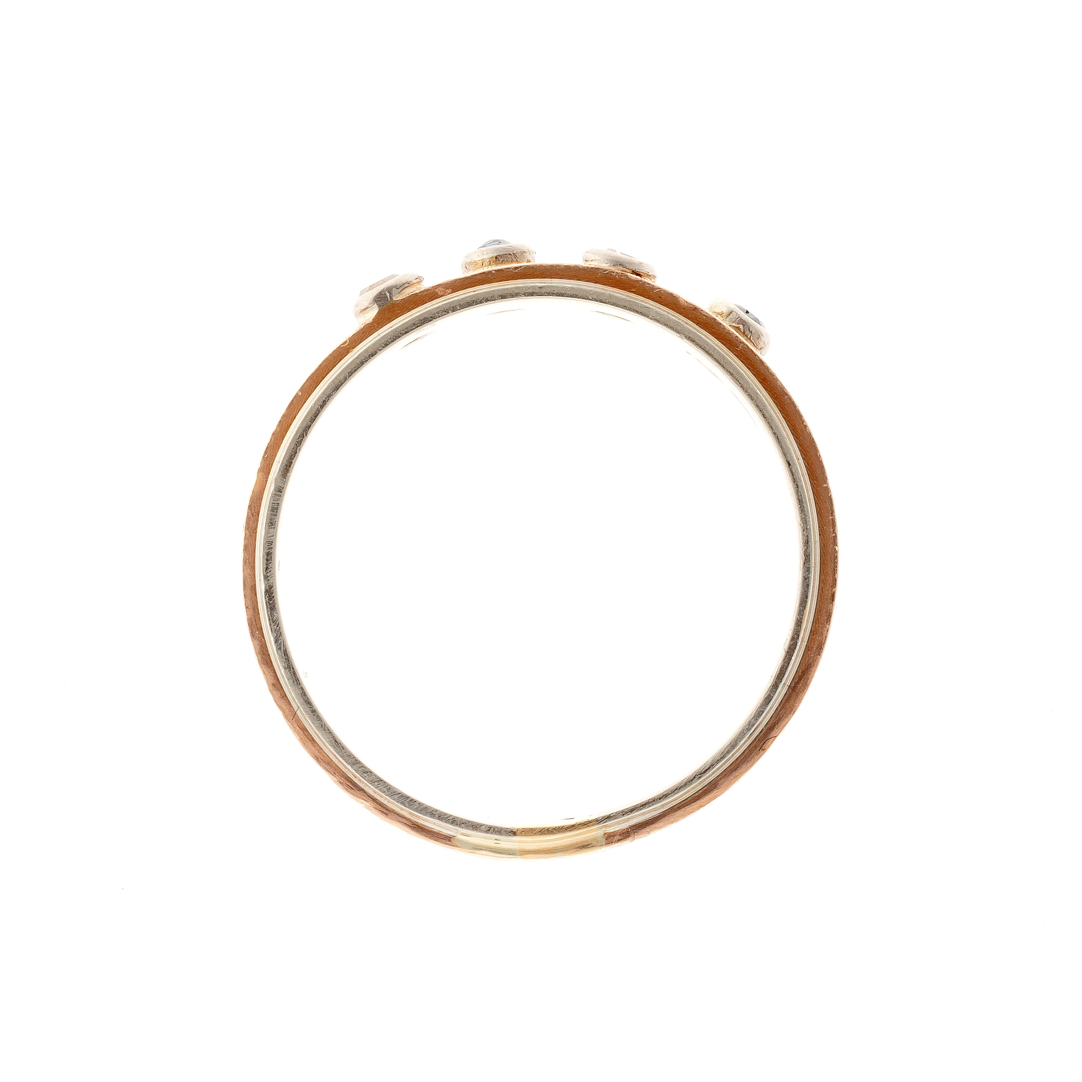 Profile of the contemporary vintage two-tone gold band ring with diamonds and sapphires.