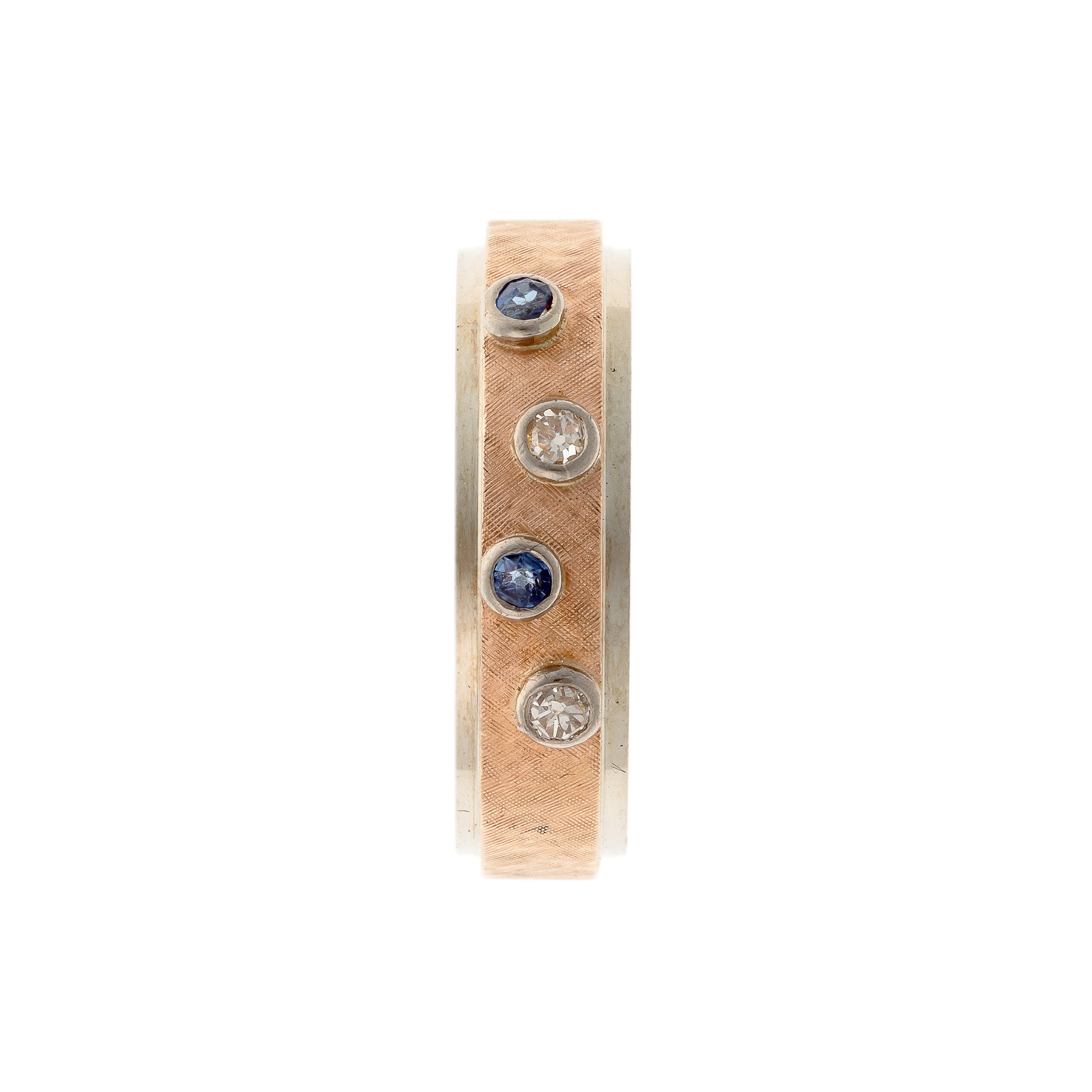 Top of the contemporary vintage two-tone gold band ring with diamonds and sapphires.