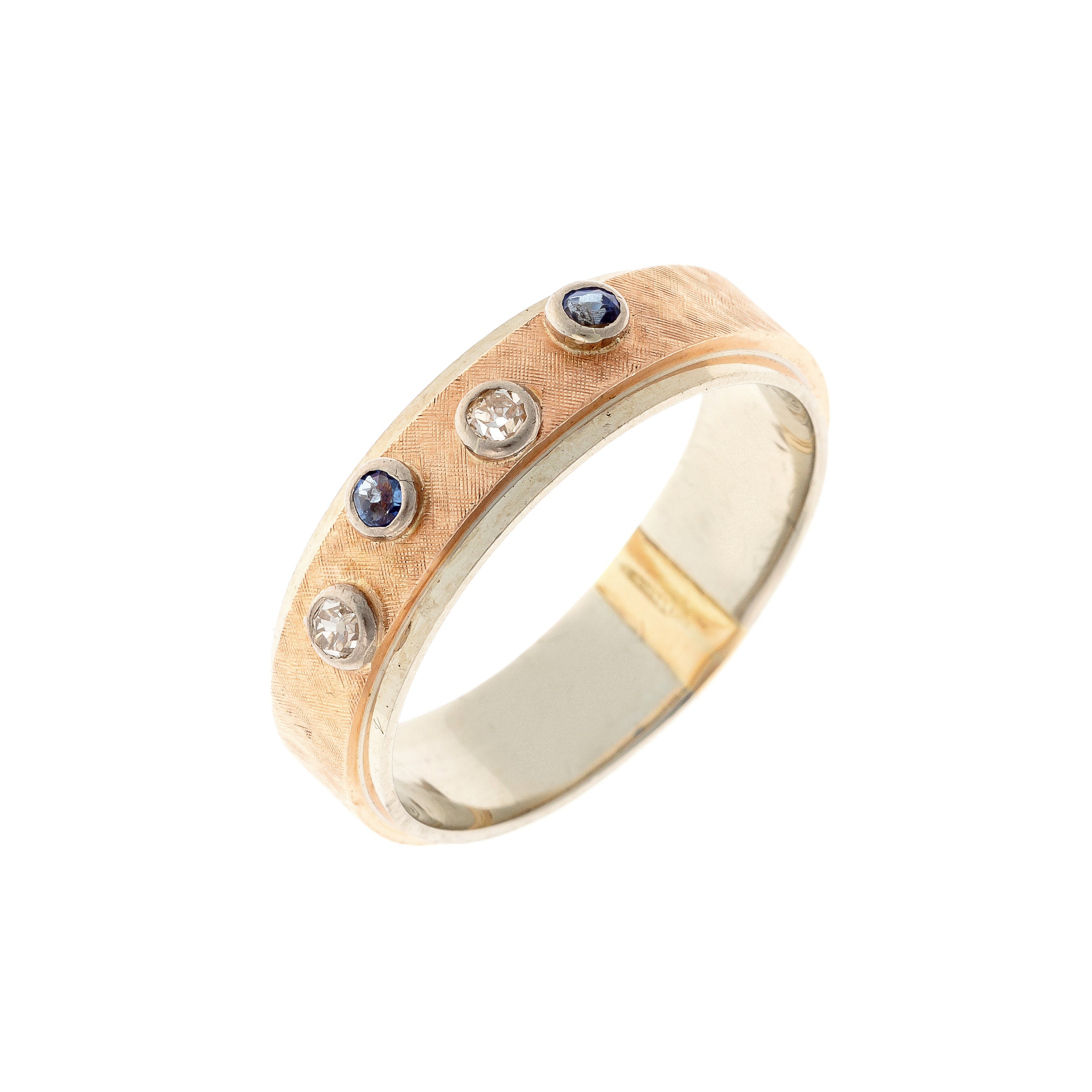 Contemporary vintage two-tone gold band ring with diamonds and sapphires.