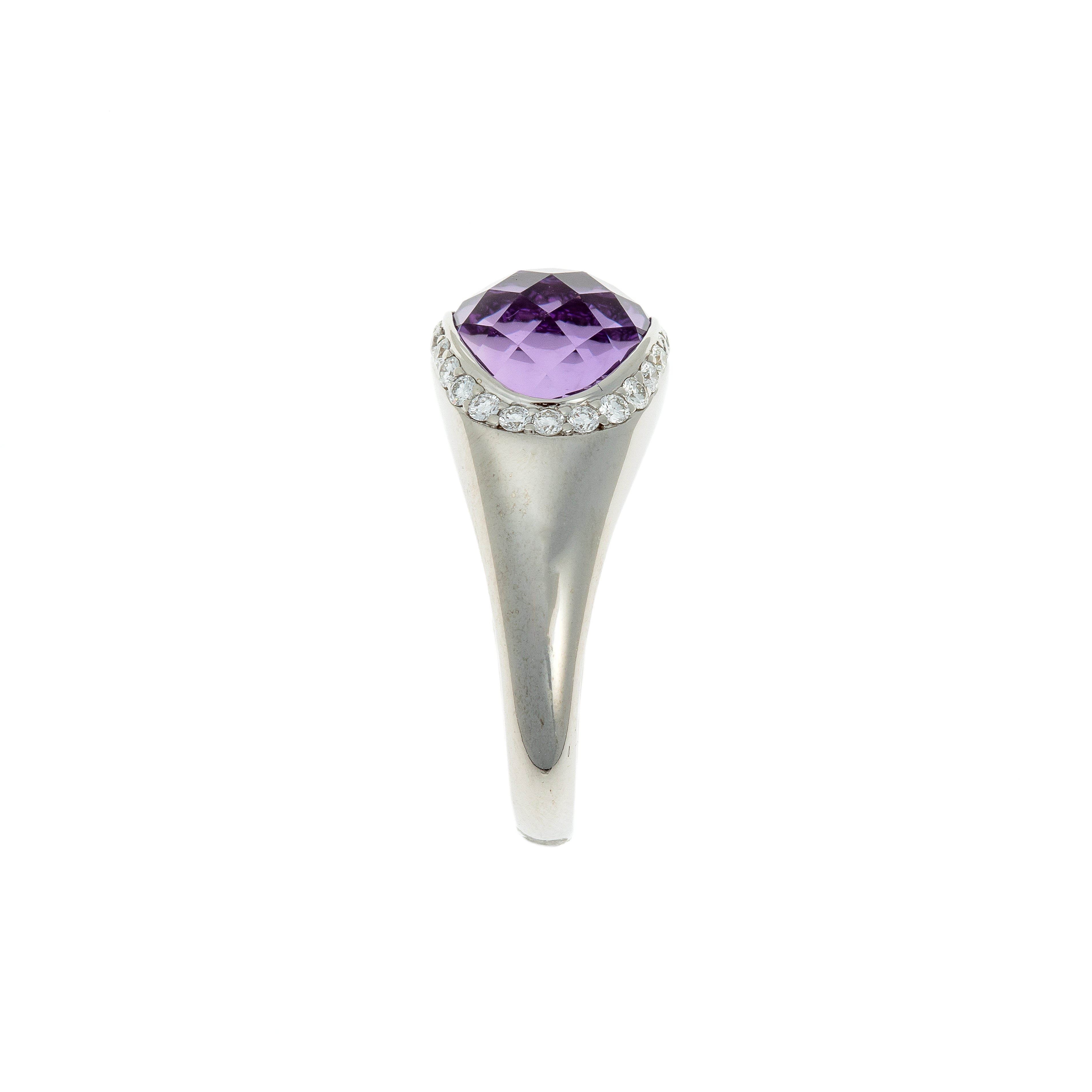 Side view of white gold amethyst ring with diamond details.