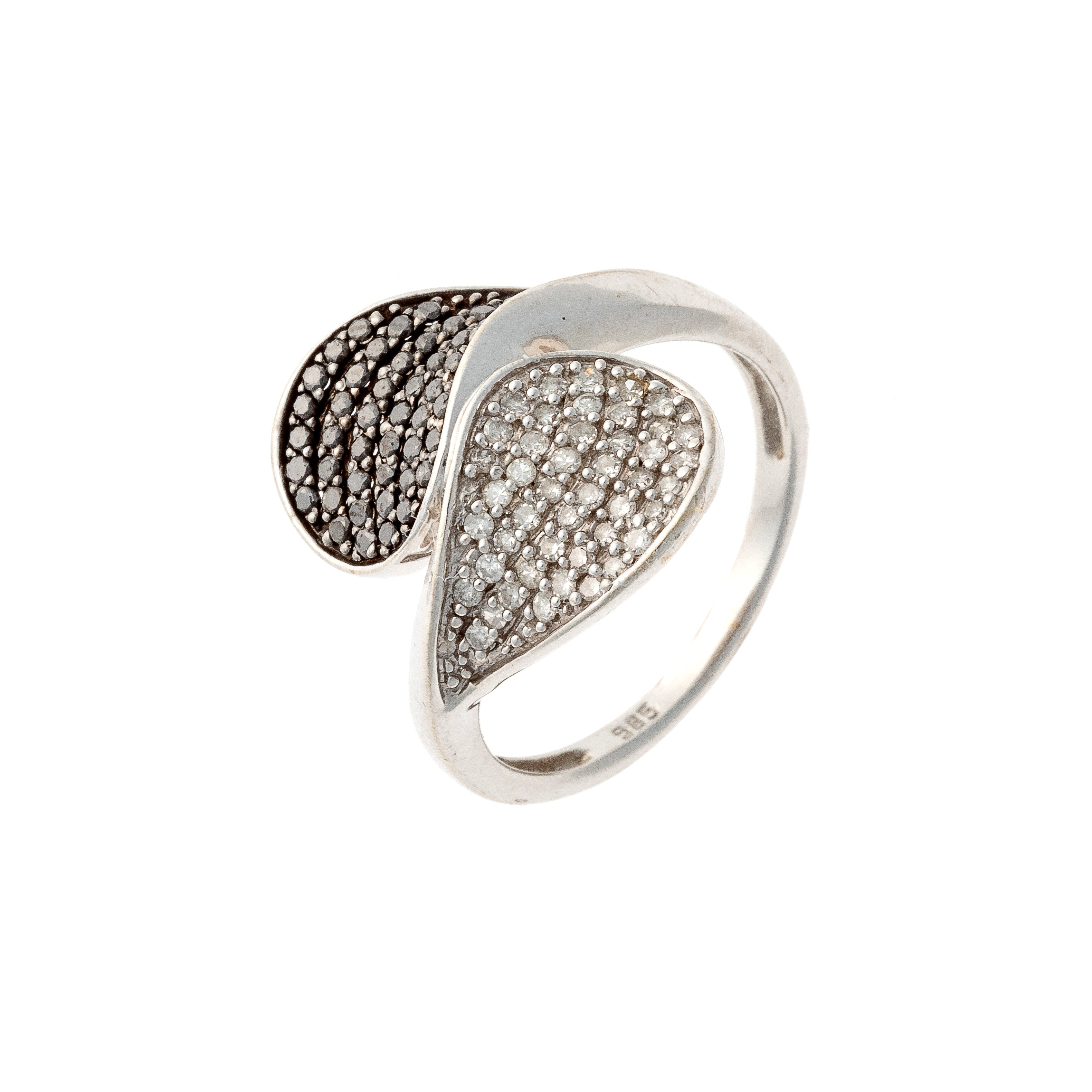 Contemporary vintage white gold ring with black and white diamonds in a yin yang design.