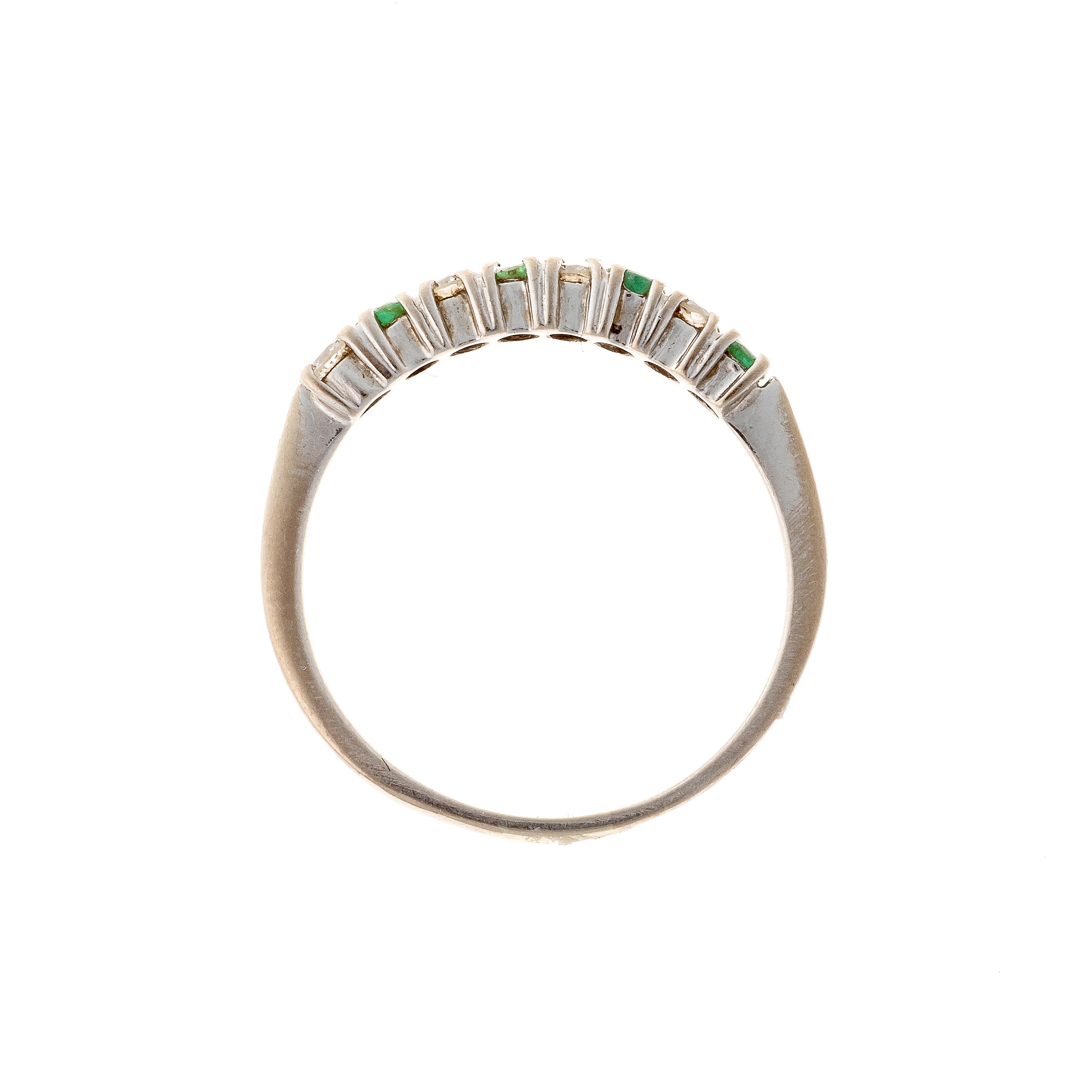 Profile of the contemporary vintage white gold emerald and diamond band ring.