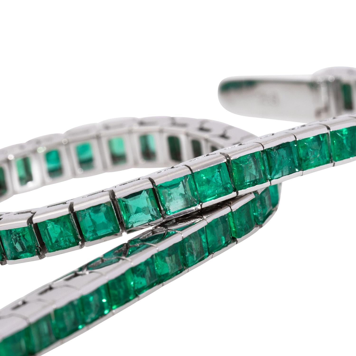 Detail of emerald links in white gold tennis bracelet, contemporary 1980s style.