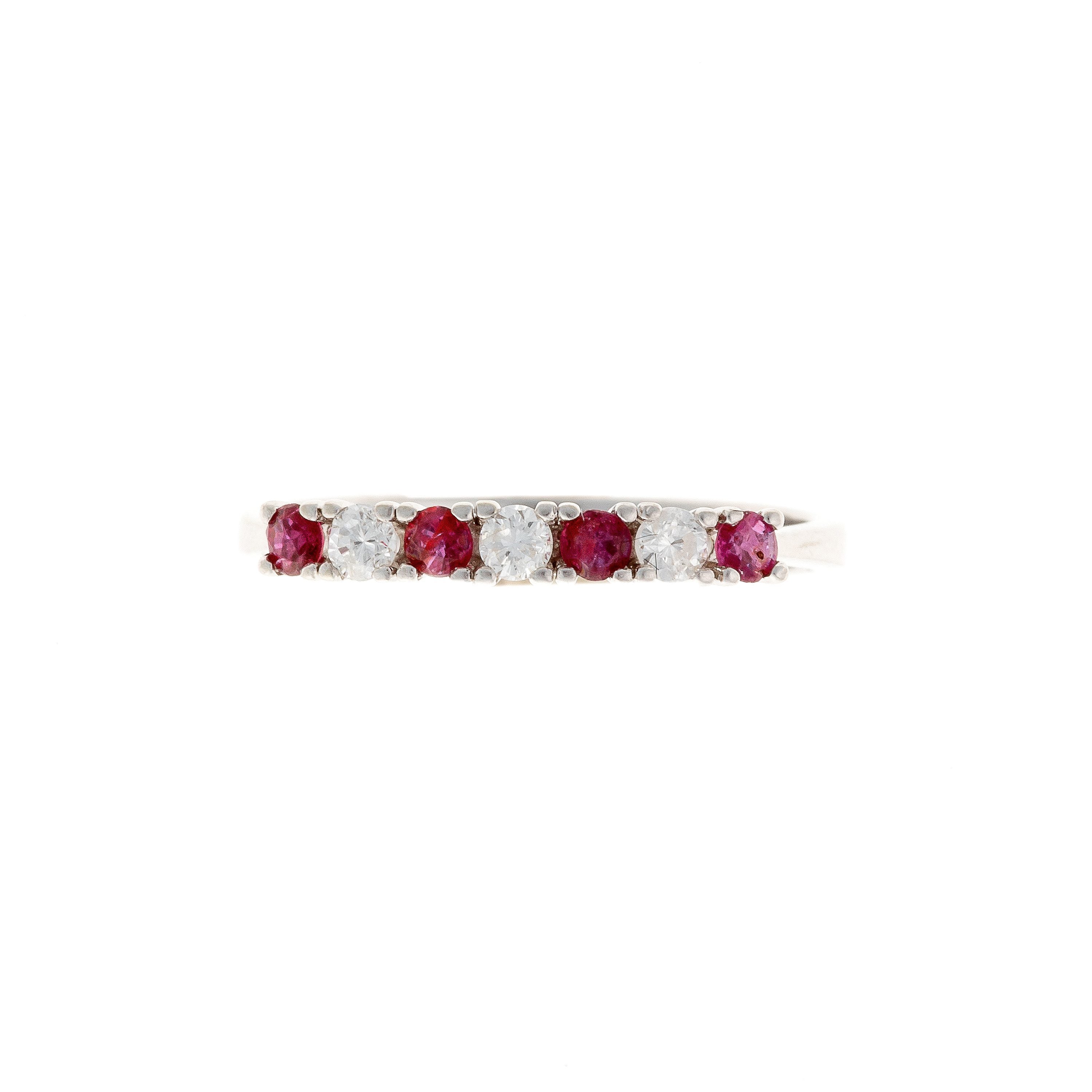 Top of the contemporary vintage white gold ruby and diamond band ring.