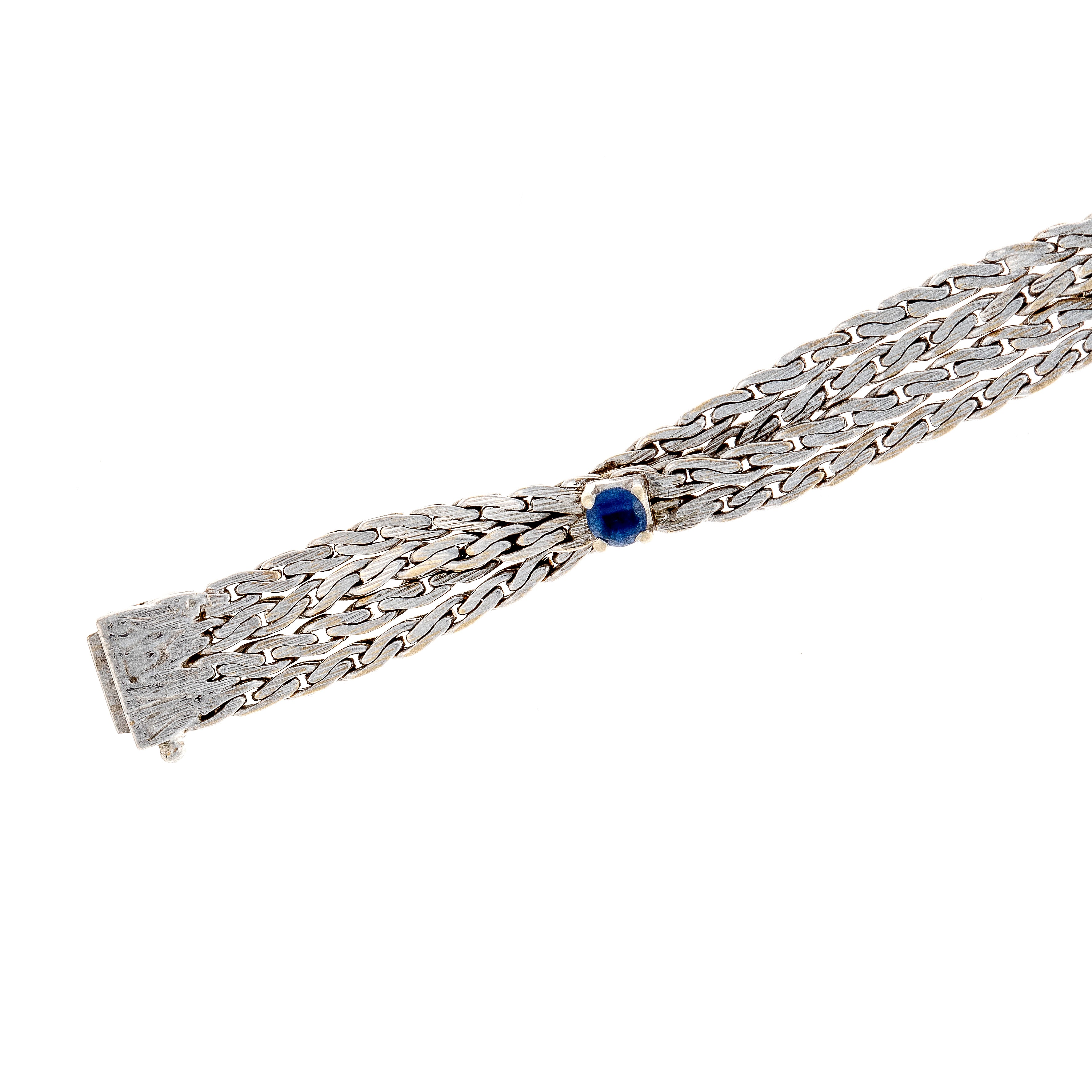 Clasp of the retro revival vintage white gold bracelet with woven design and round sapphires.