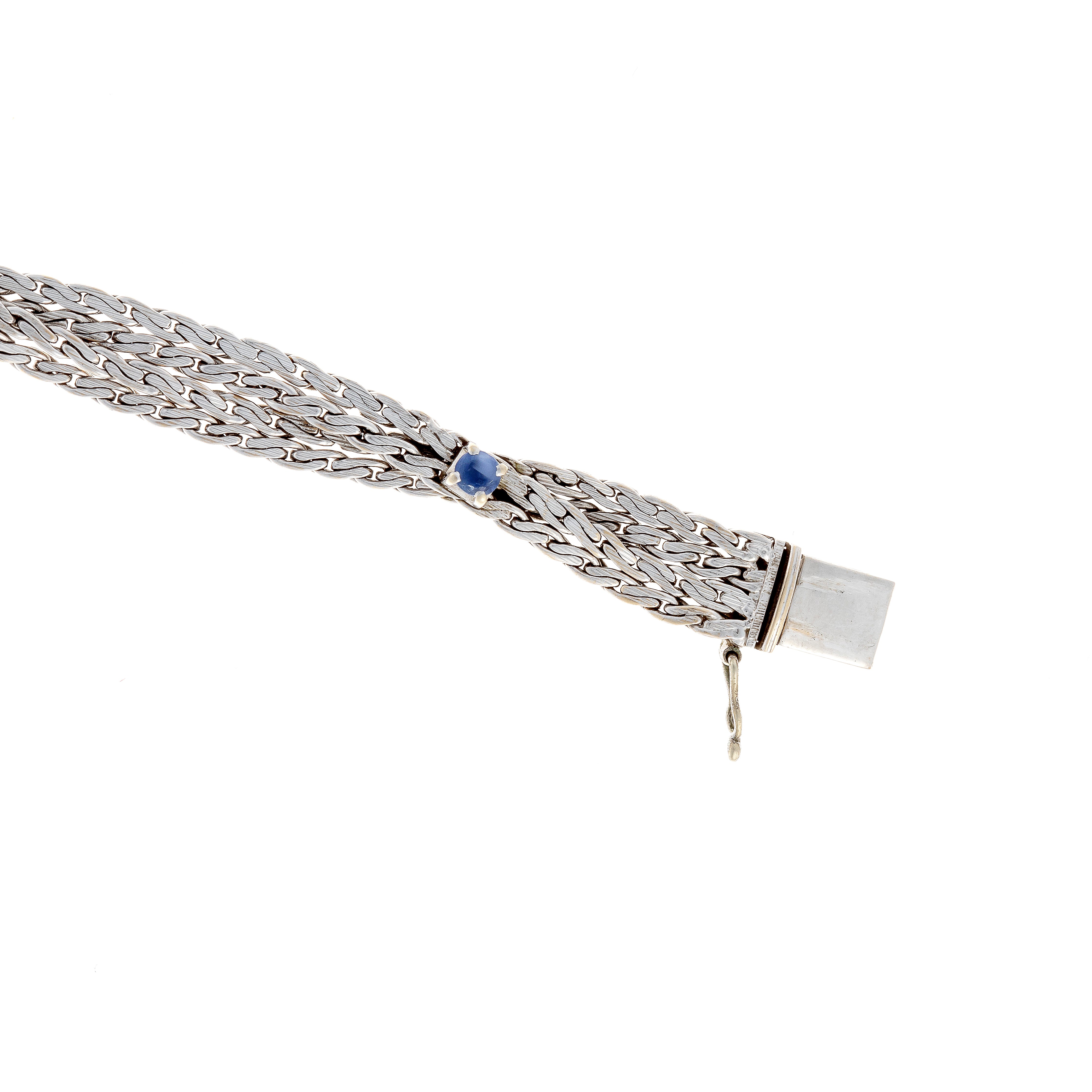 Clasp of the retro revival vintage white gold bracelet with woven design and round sapphires.