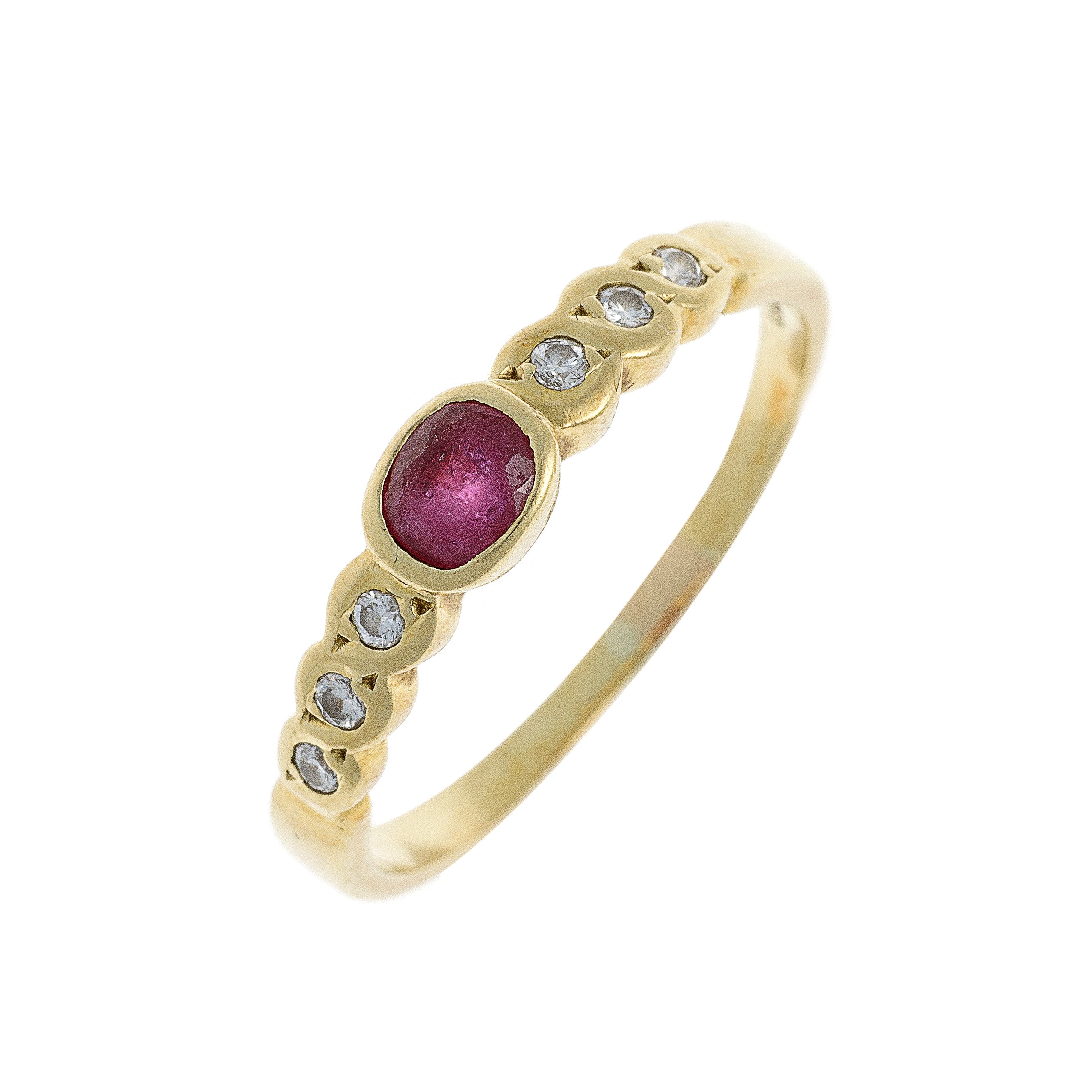 Angled side view of the estate ruby and diamond ring, showcasing its curved gold band and bezel-set gemstones.