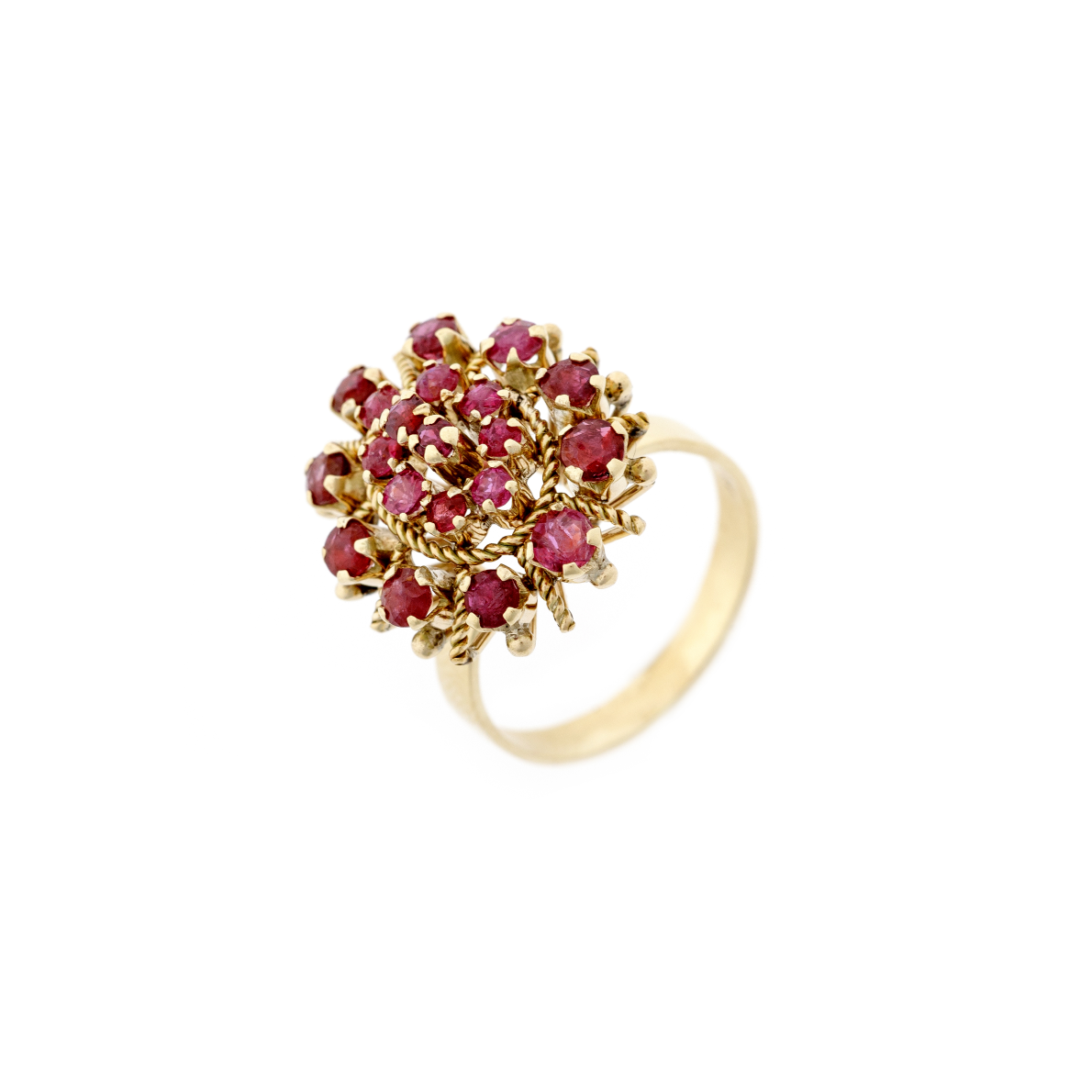 Side view of the estate gold ring, showcasing the elevated prong setting and the way the rubies catch the light from different angles.
